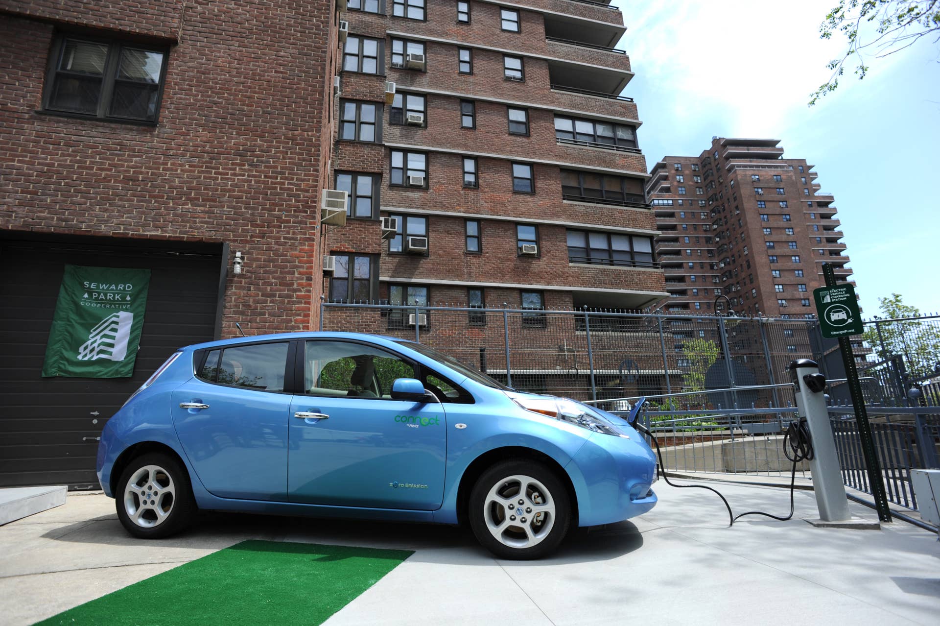 A Nissan Leaf electric car is plugged into a charging station at the Seward Park Co-op apartments on the Lower East Side of Manhattan May 6, 2011 in New York. Connect by Hertz unveiled its first rental electric car and charging station in New York City where customers can rent this car by the hour. AFP PHOTO/Stan HONDA (Photo credit should read STAN HONDA/AFP/Getty Images)