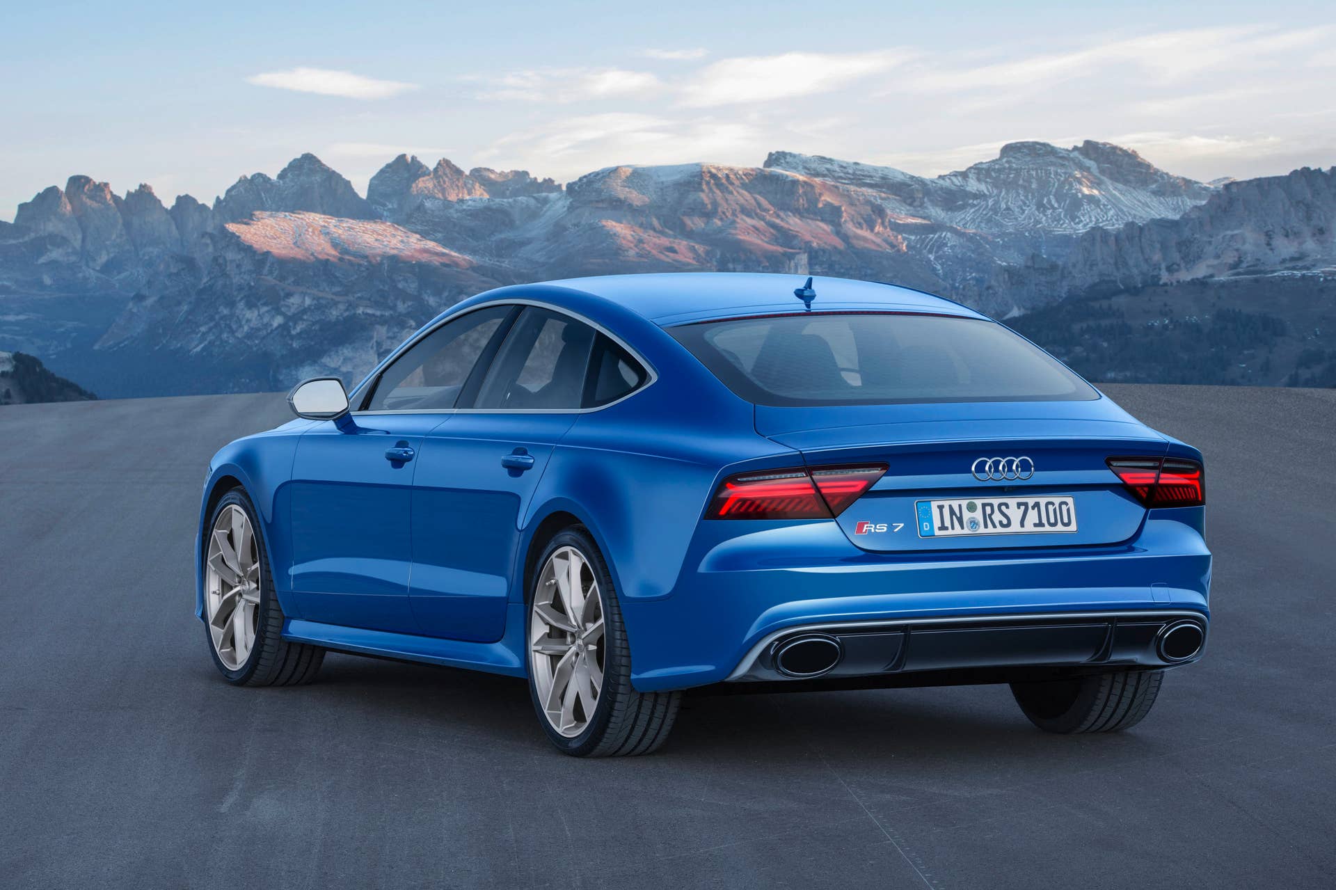 blue audi rs7 sportback performance rear three quarters mountains