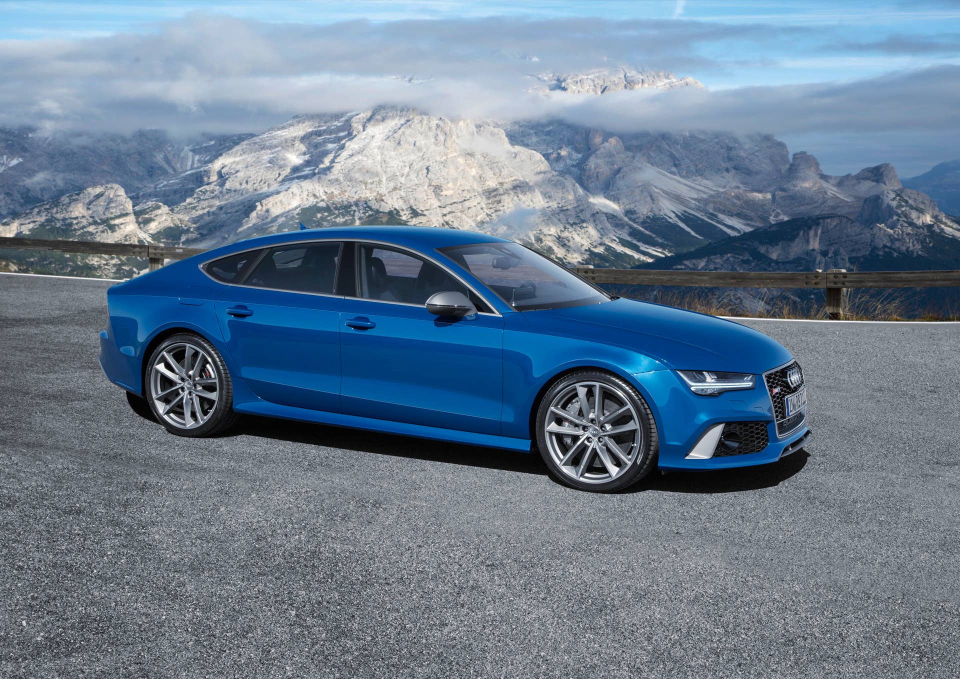 blue audi rs7 sportback performance in the mountains