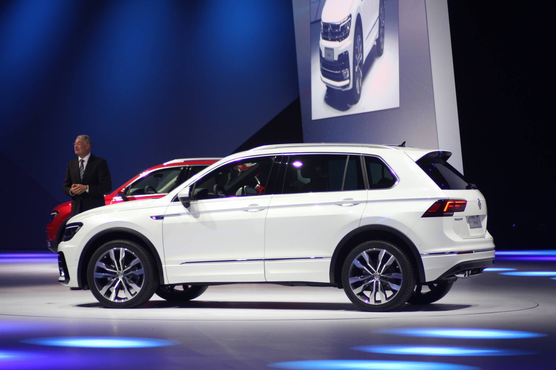 The 2016 Volkswagen Tiguan R-Line, unveiled at Volkswagen's Group Night ahead of the 2015 Frankfurt Motor Show, near rear three-quarter view.