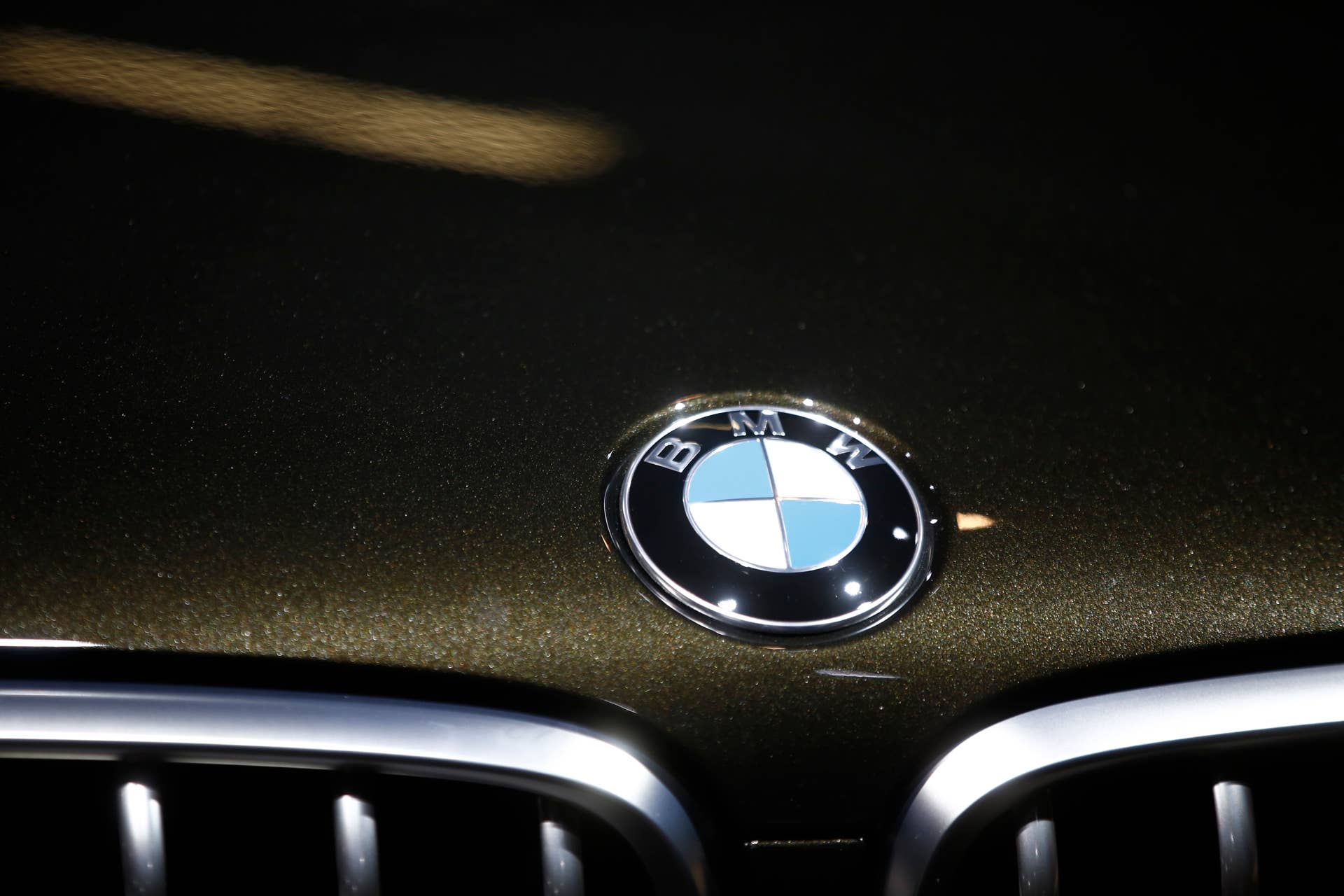 A badge sits on the hood of a BMW X6 automobile, produced by Bayerische Motoren Werke AG (BMW), at the Paris Motor Show on the final preview day in Paris, France, on Friday, Oct. 3, 2014. The show, also known as Mondial de L'Automobile, runs from Oct. 4 through Oct. 19 and showcases 250 automobile manufacturers from 18 countries. Photographer: Simon Dawson/Bloomberg via Getty Images