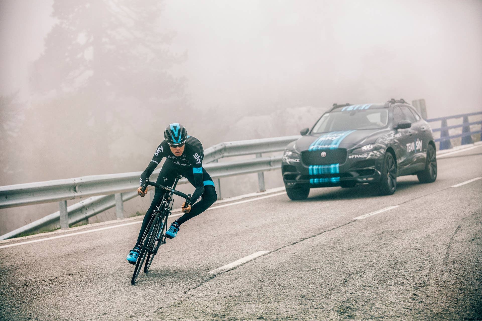 cyclist corner jaguar f-pace background fog