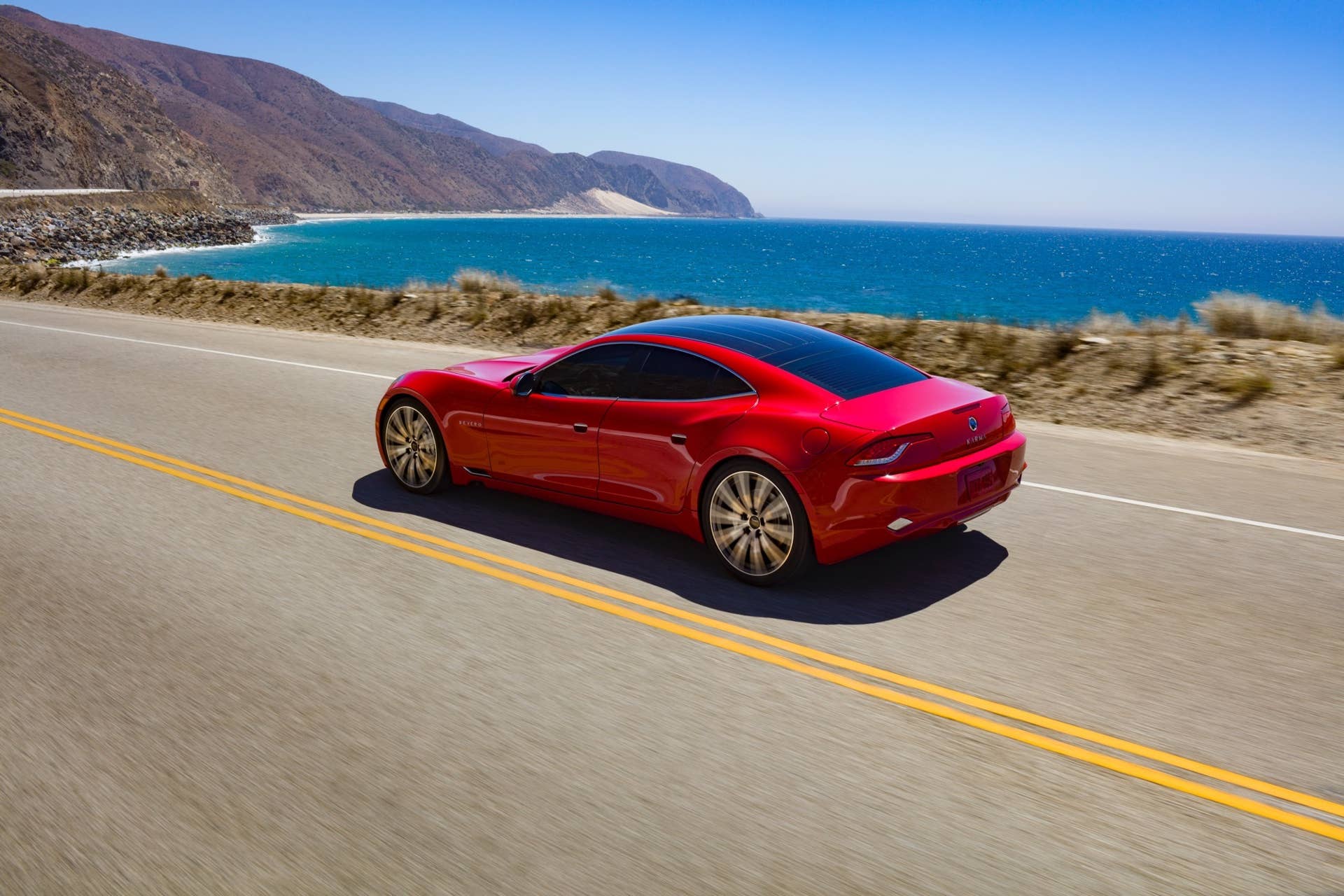 2017 Karma Revero in red by ocean