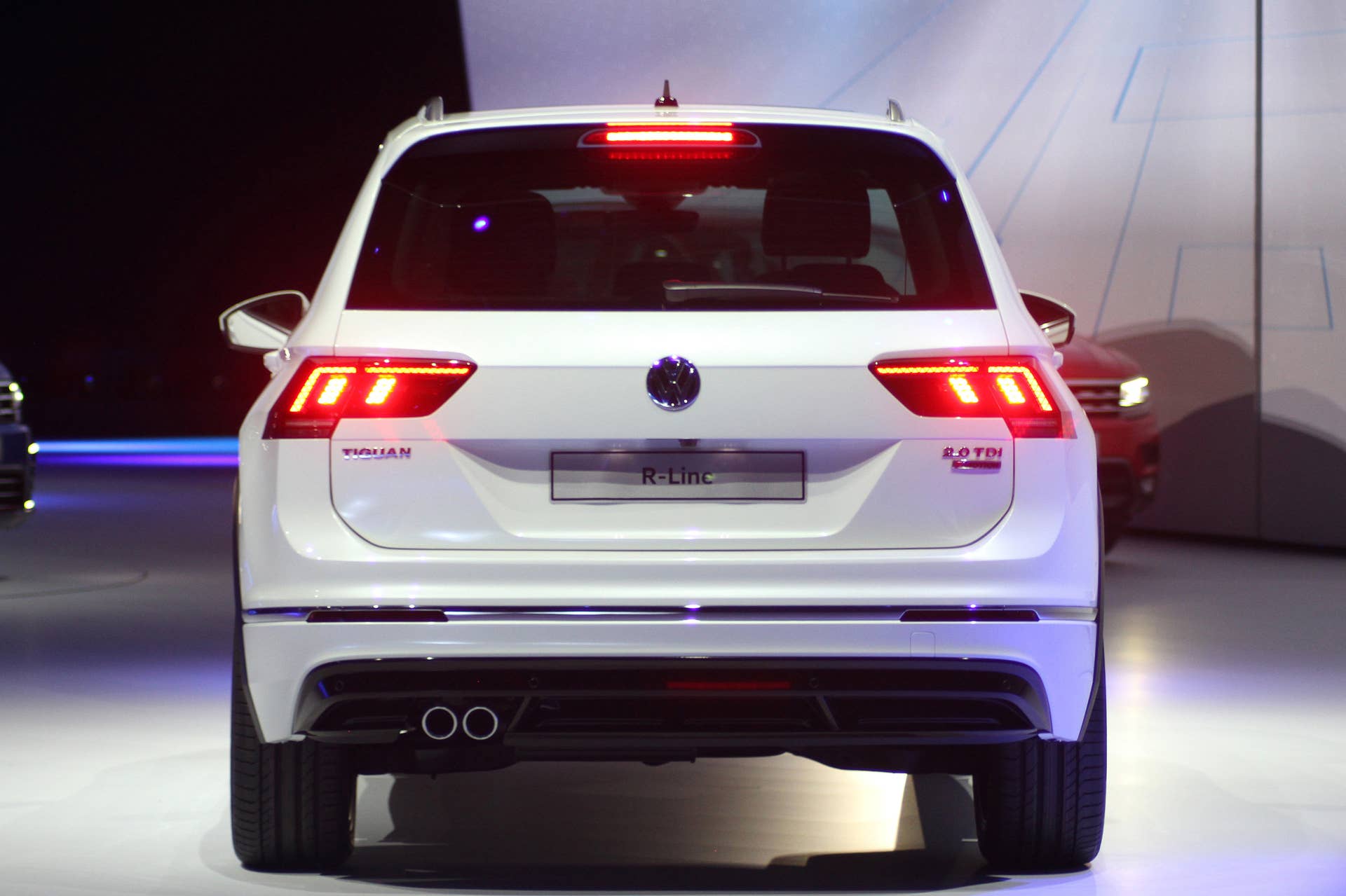 The 2016 Volkswagen Tiguan R-Line, unveiled at Volkswagen's Group Night ahead of the 2015 Frankfurt Motor Show, rear view with brake lights on.