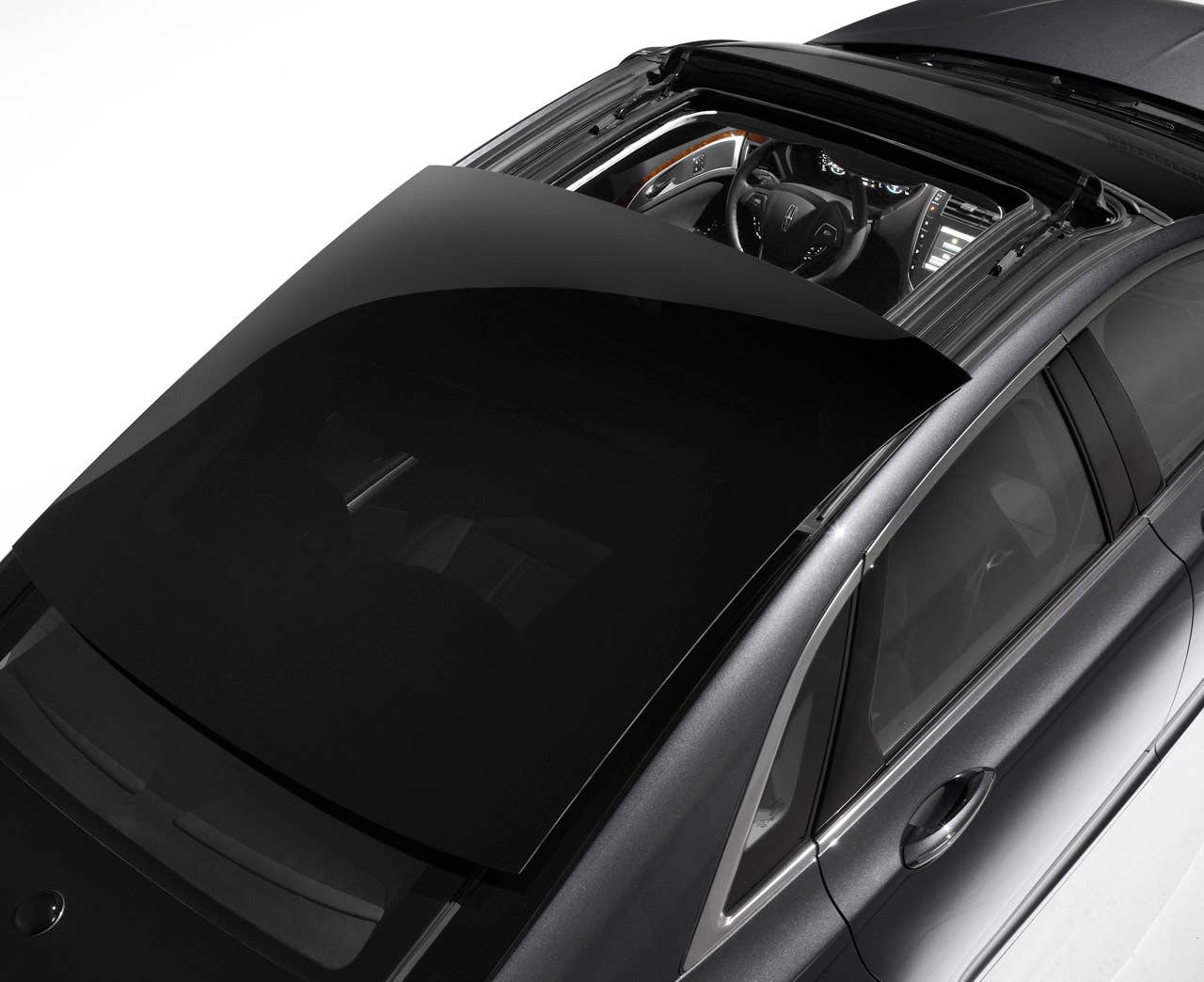 2013 Lincoln MKZ: The sweeping profile of the 2013 Lincoln MKZ incorporates one of the world's widest-opening retractable glass roofs.