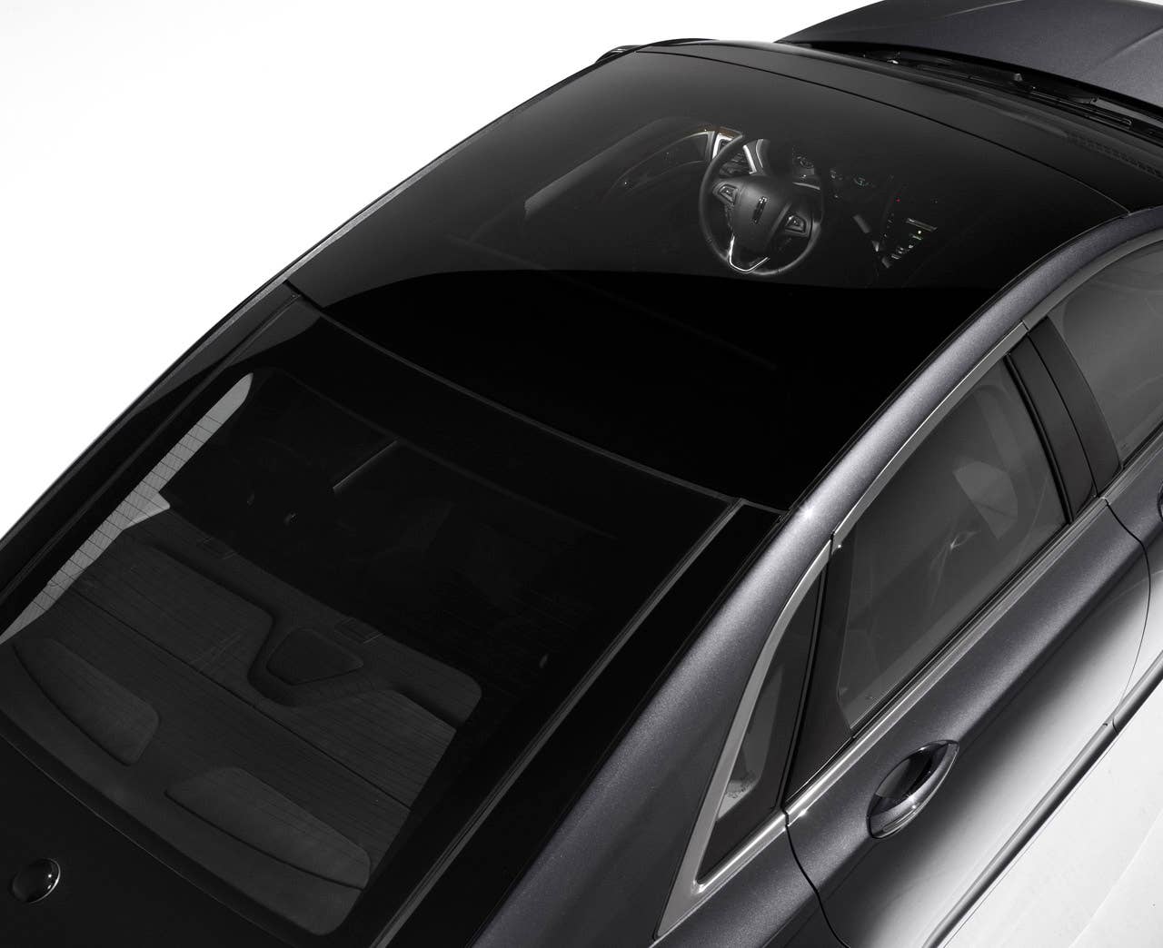 2013 Lincoln MKZ: The sweeping profile of the 2013 Lincoln MKZ incorporates one of the world's widest-opening retractable glass roofs.