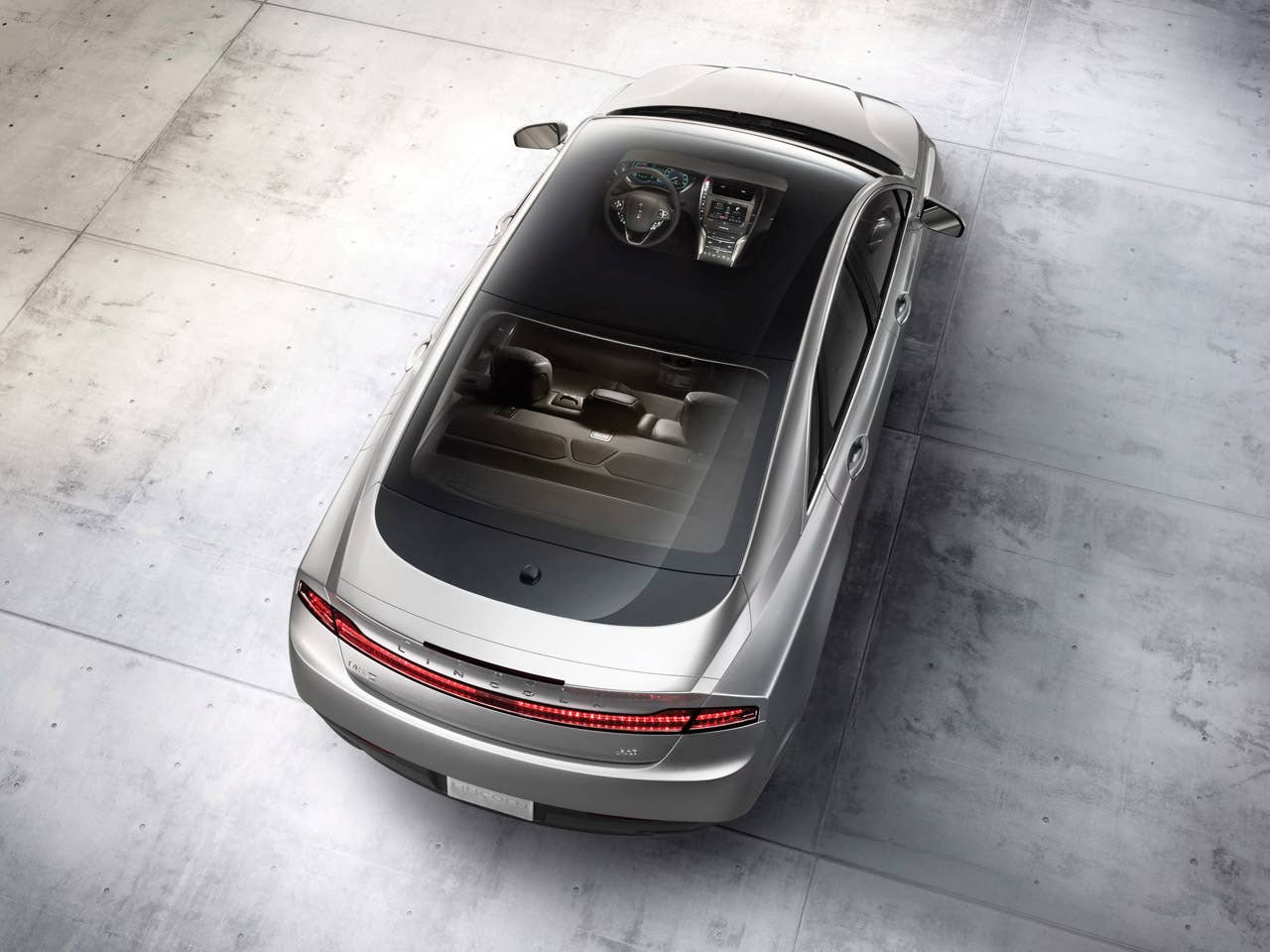 2013 Lincoln MKZ: The sweeping profile of the 2013 Lincoln MKZ incorporates one of the world's widest-opening retractable glass roofs.