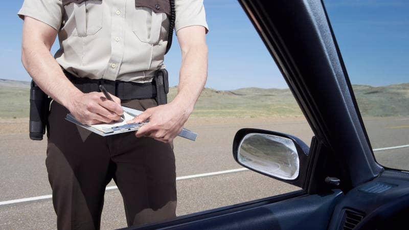 highway patrolman writing ticket