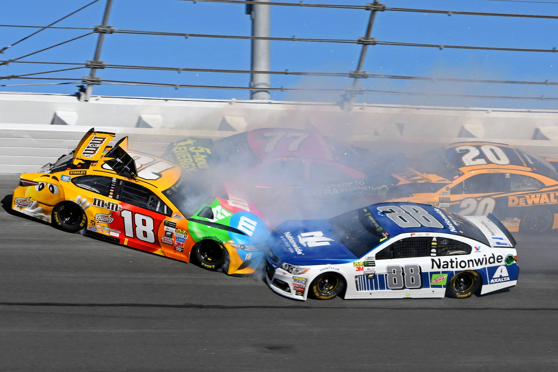 Feb 26, 2017; Daytona Beach, FL, USA; NASCAR Cup Series driver Dale Earnhardt Jr. (88) and NASCAR Cup Series driver Kyle Busch (18) wreck during the 2017 Daytona 500 at Daytona International Speedway. Mandatory Credit: Mike DiNovo-USA TODAY Sports