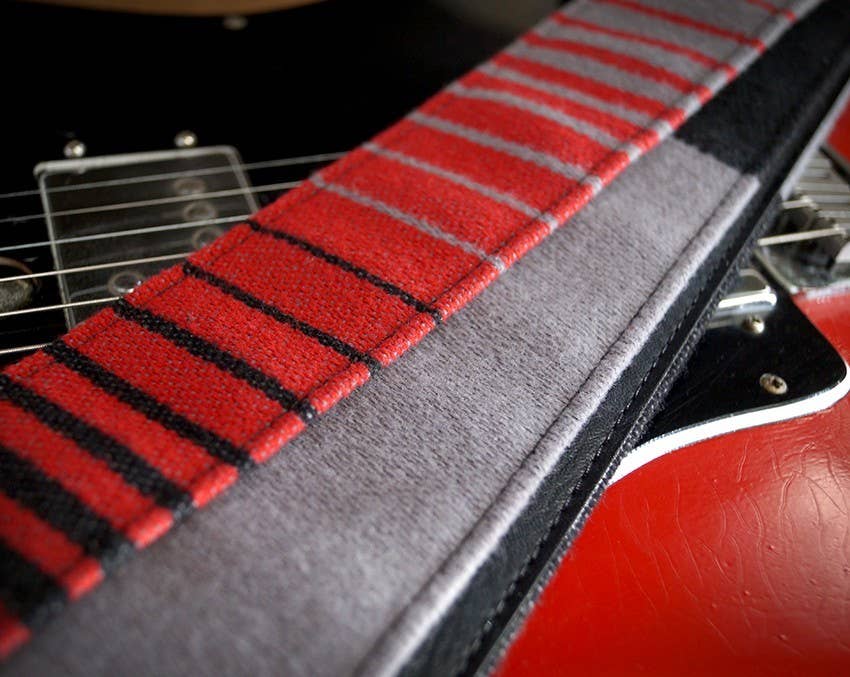 Guitar strap made from '80s Volkswagen Golf upholstery.