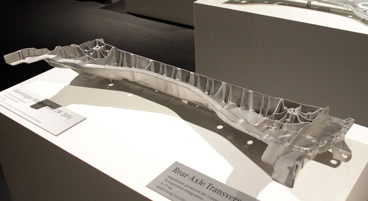 The single-piece aluminum rear axle transverse beam, six pounds lighter than its steel counterpart.