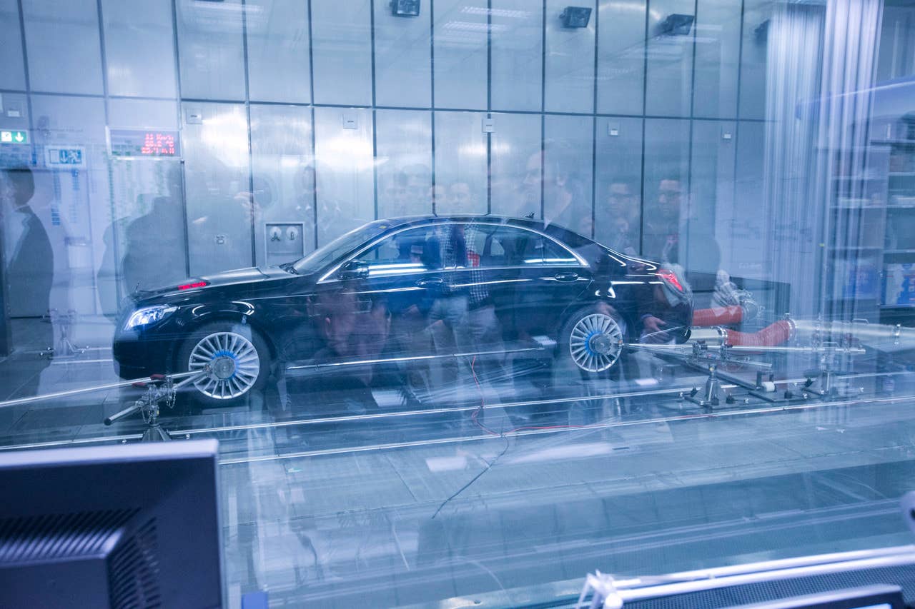 An S-Class also being temperature tested on another rolling road.