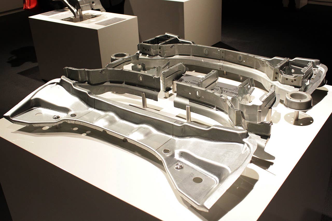 The pieces of the steel rear axle transverse beam.