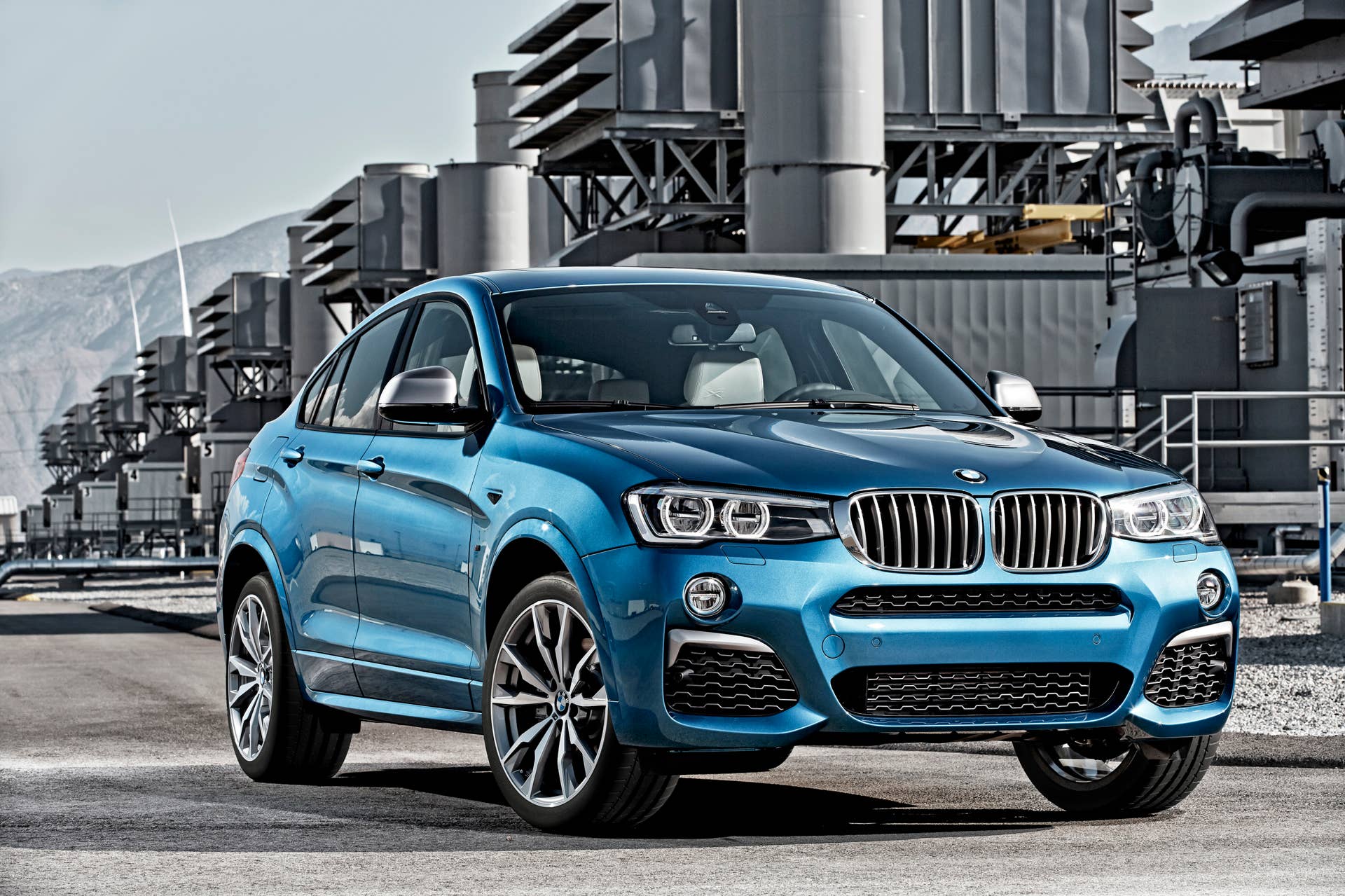 BMW X4 M40i front 3/4 industrial static parked