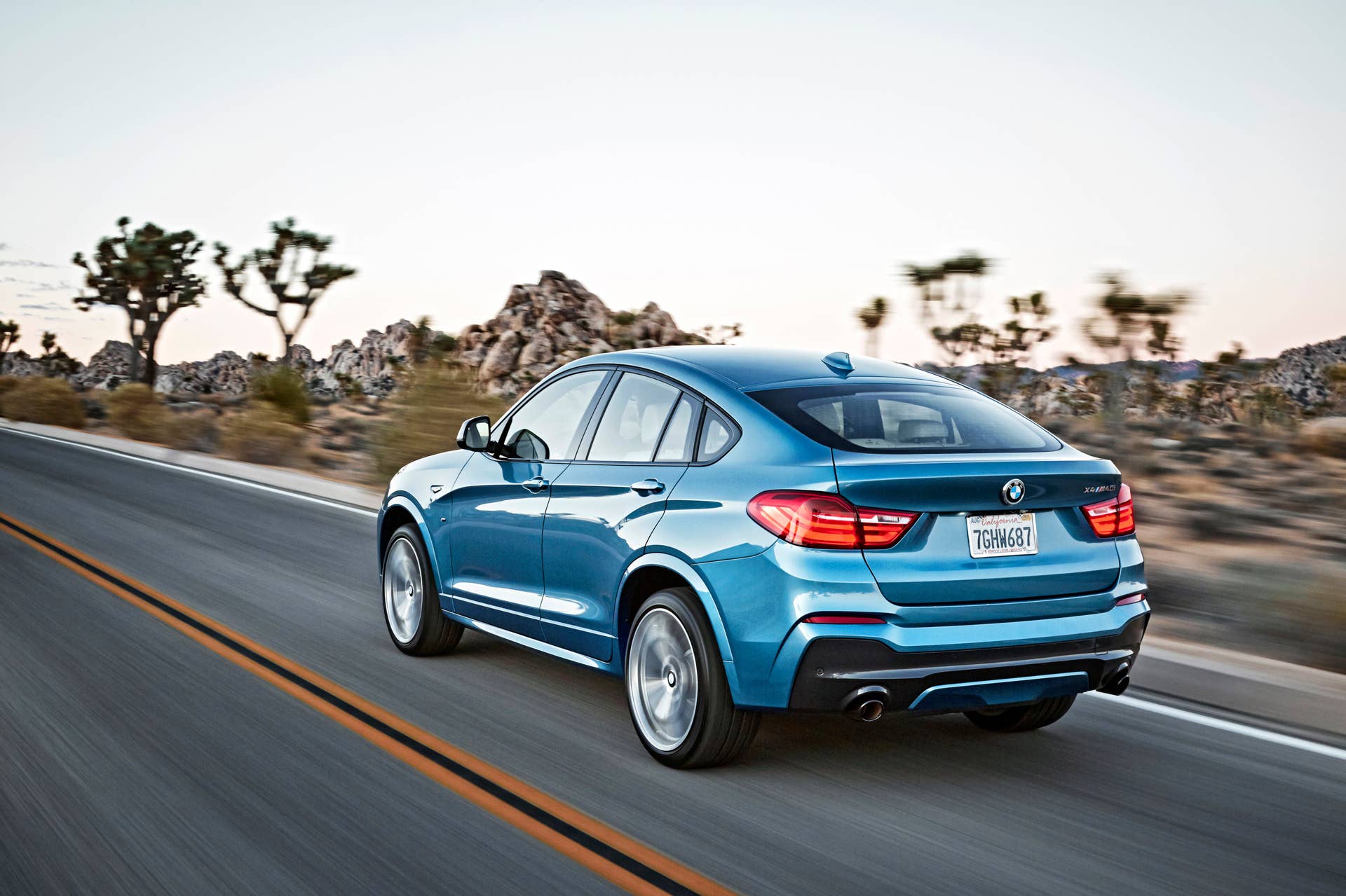BMW X4 M40i rear 3/4 view blue