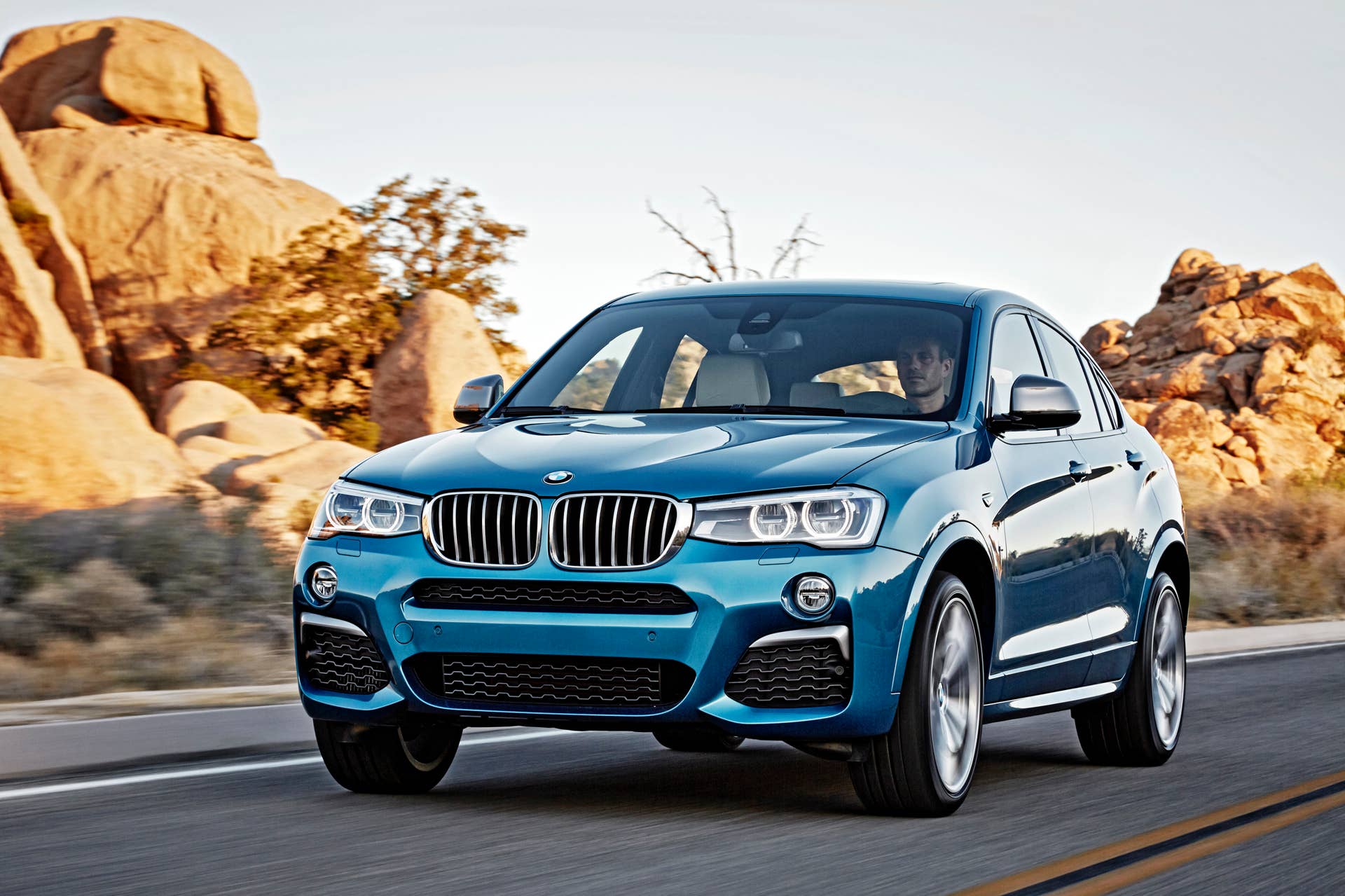 BMW X4 M40i front 3/4 rolling sunset