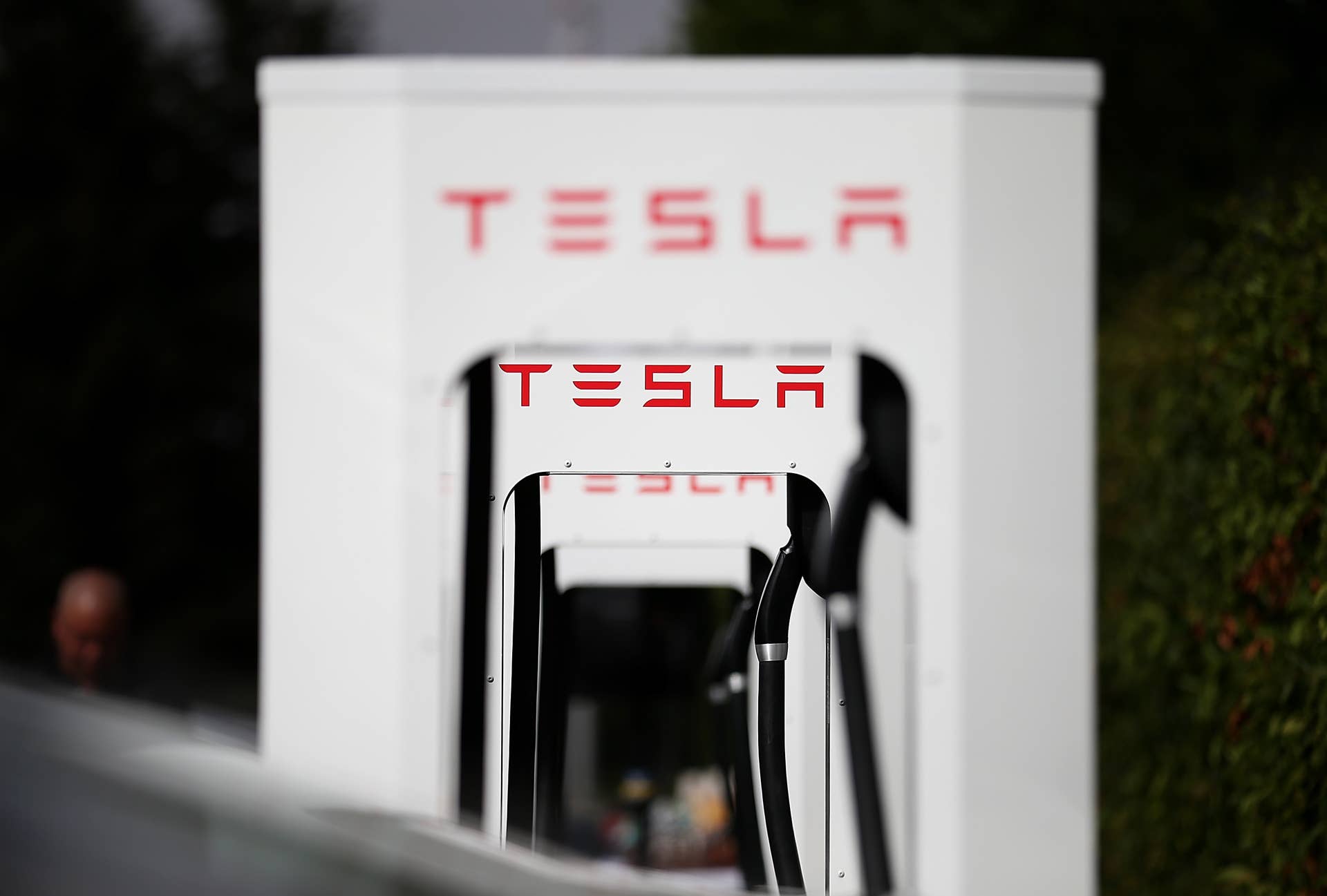 A row of new Tesla Superchargers are seen outside of the Tesla Factory on August 16, 2013 in Fremont, California.