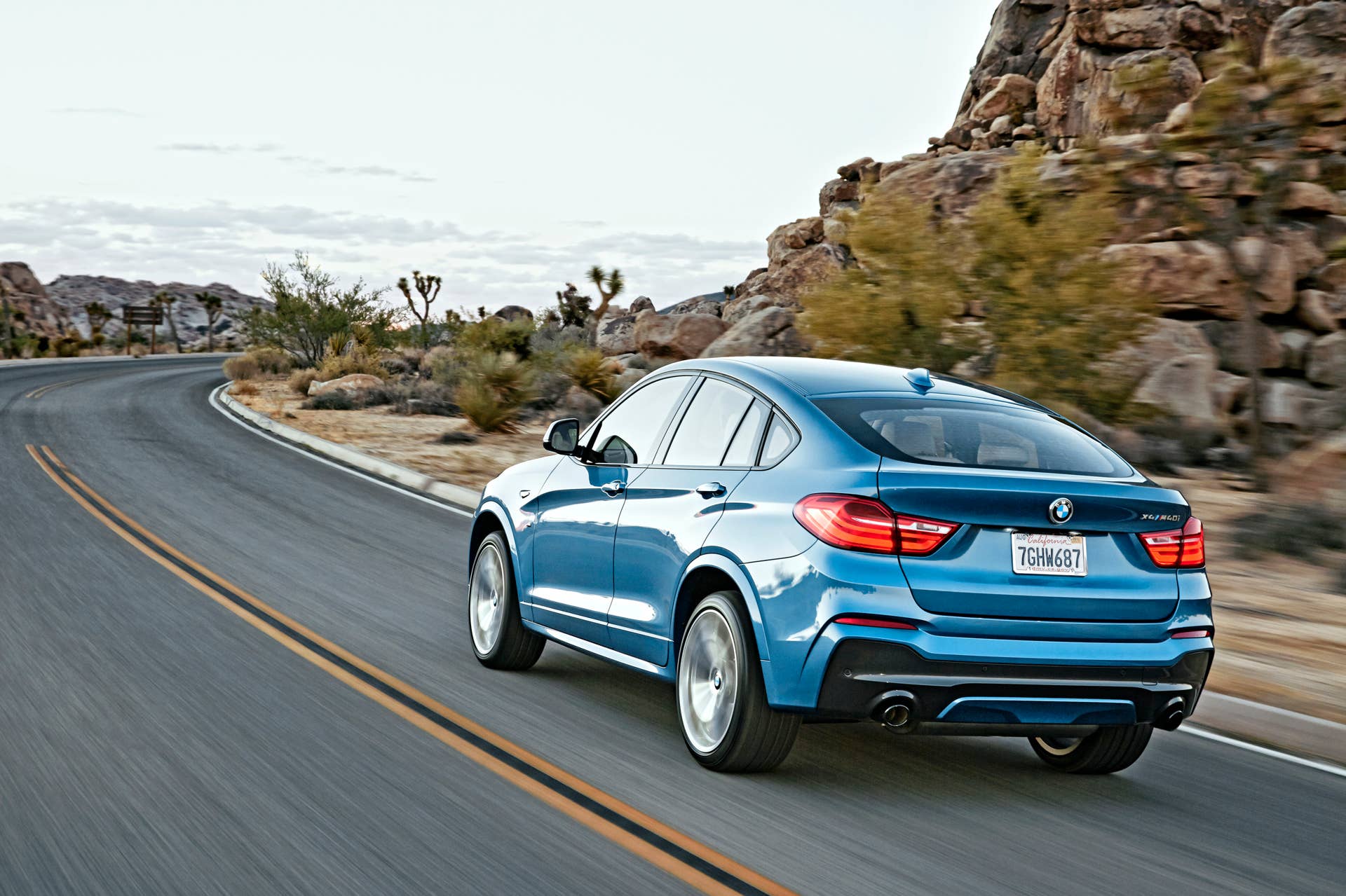 BMW X4 M40i rear 3/4 view moving