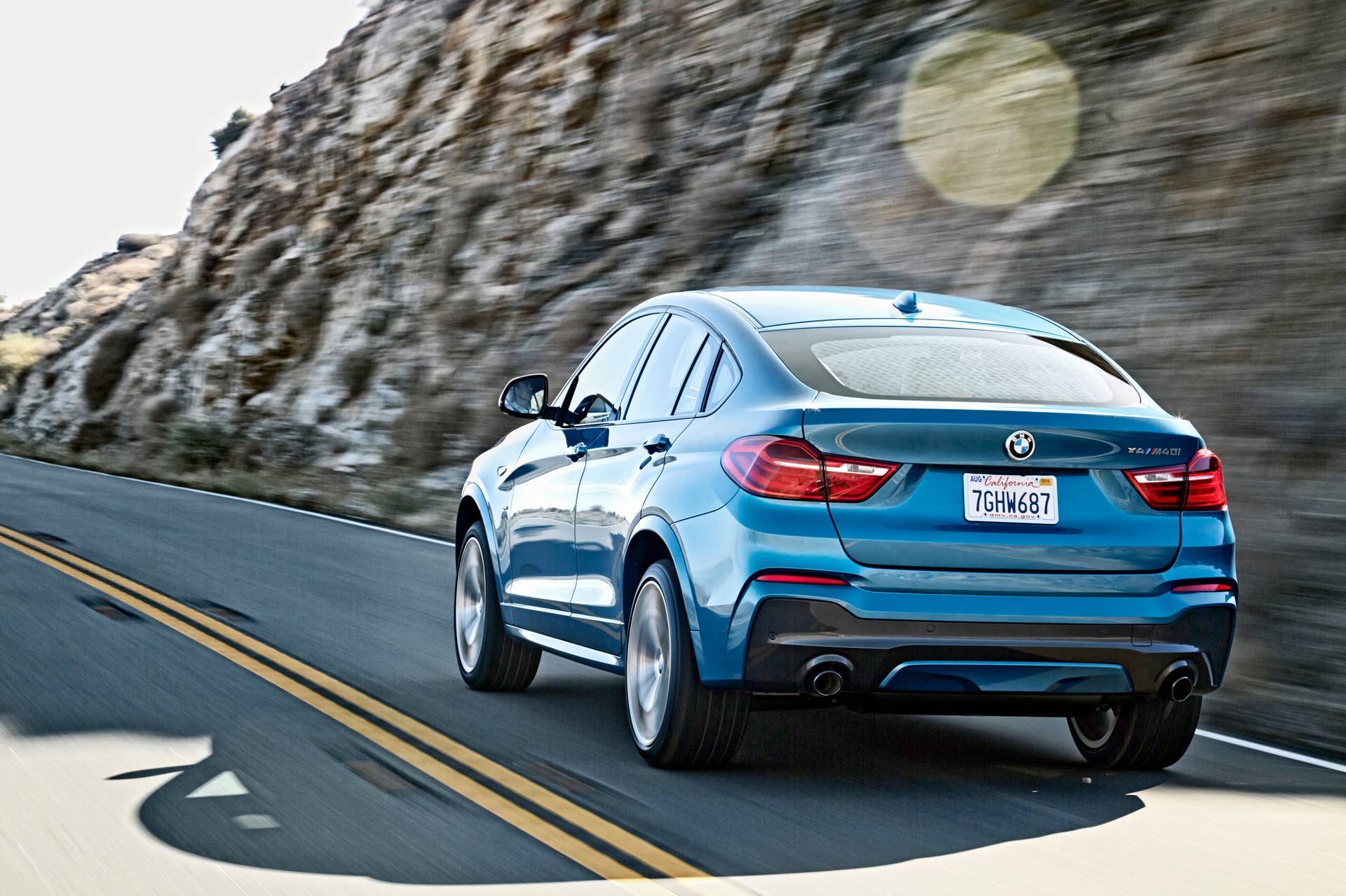 BMW X4 M40i rear 3/4 view rolling