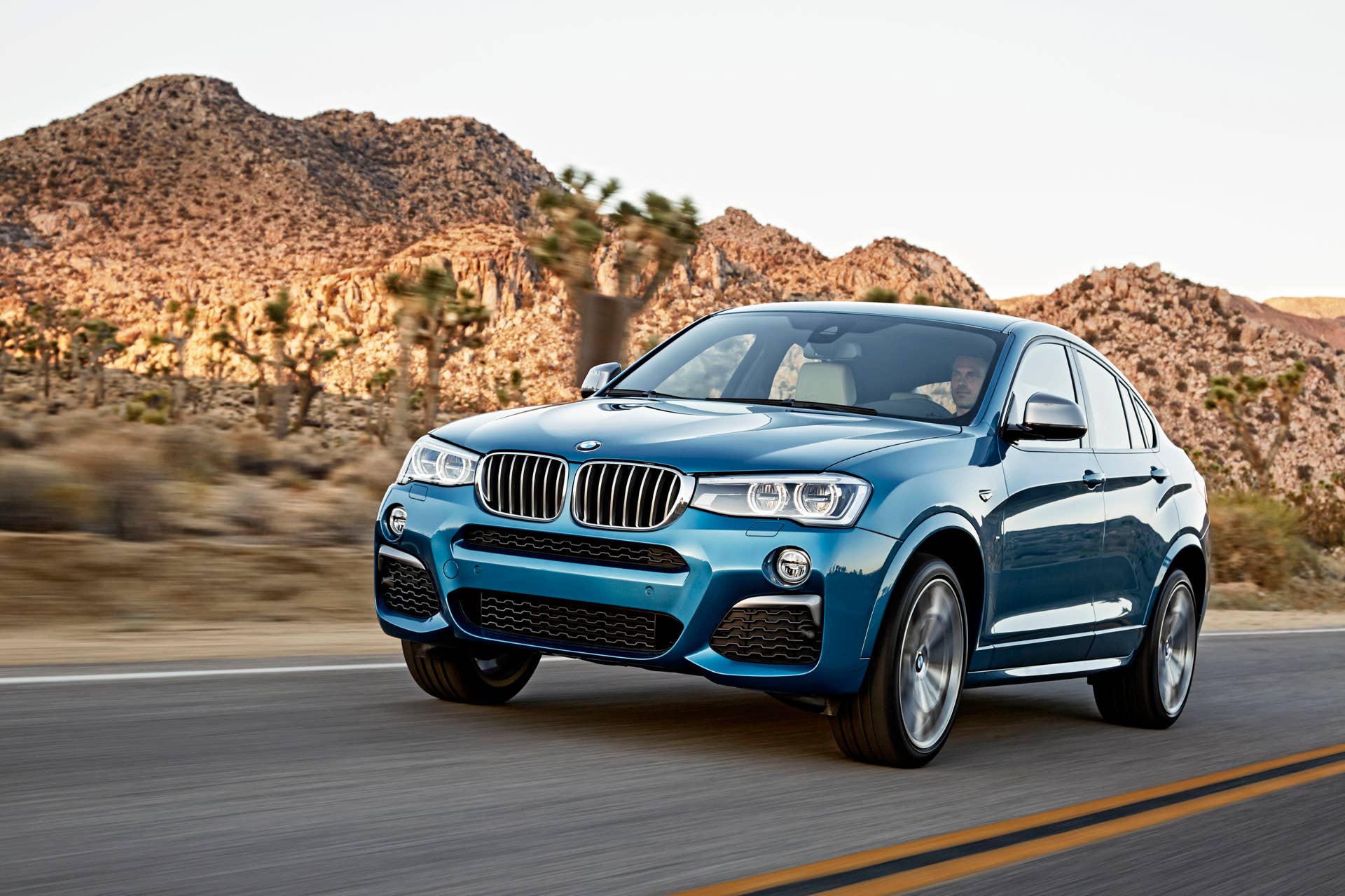 BMW X4 M40i front 3/4 driving road