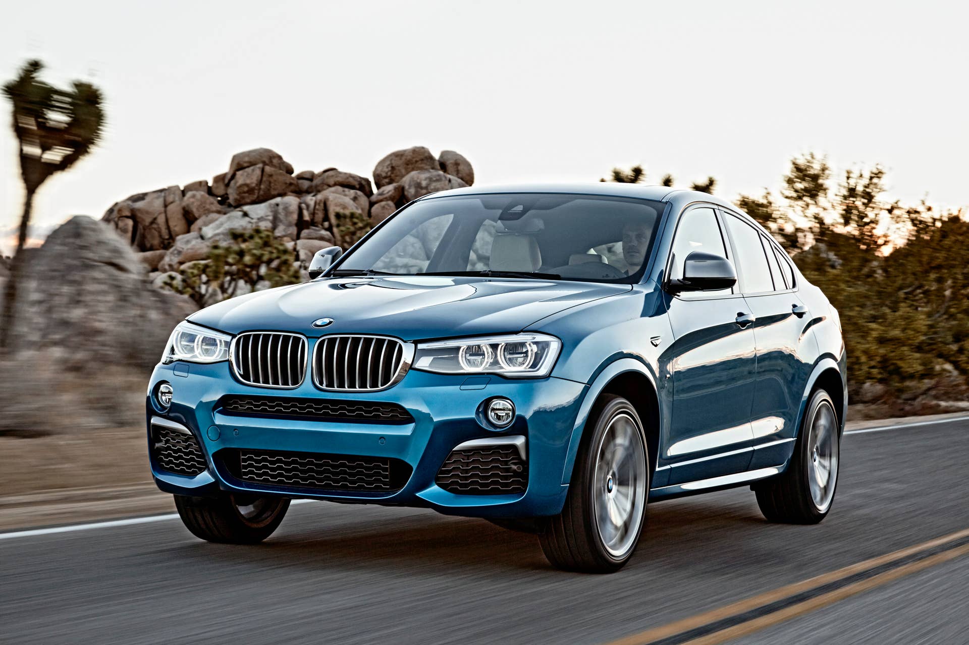 BMW X4 M40i front 3/4 driving