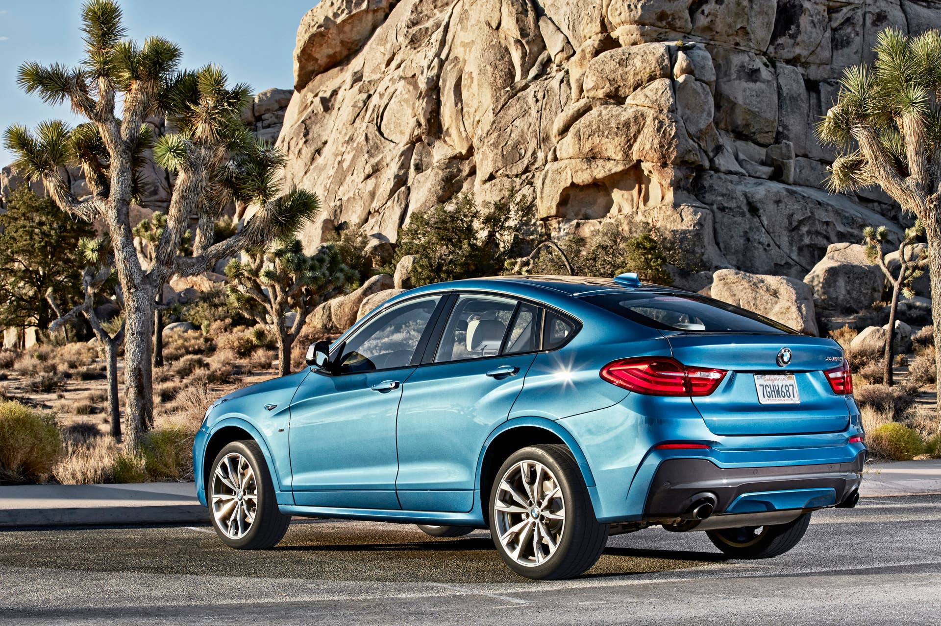 BMW X4 M40i rear 3/4 static road parked