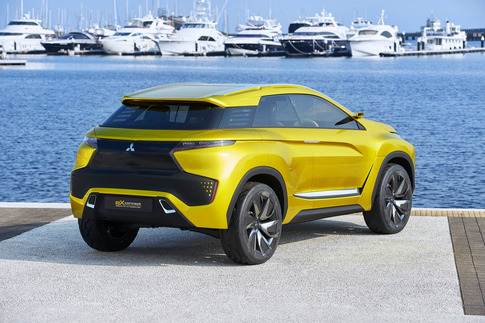 yellow mitsubishi ex concept rear three quarters water