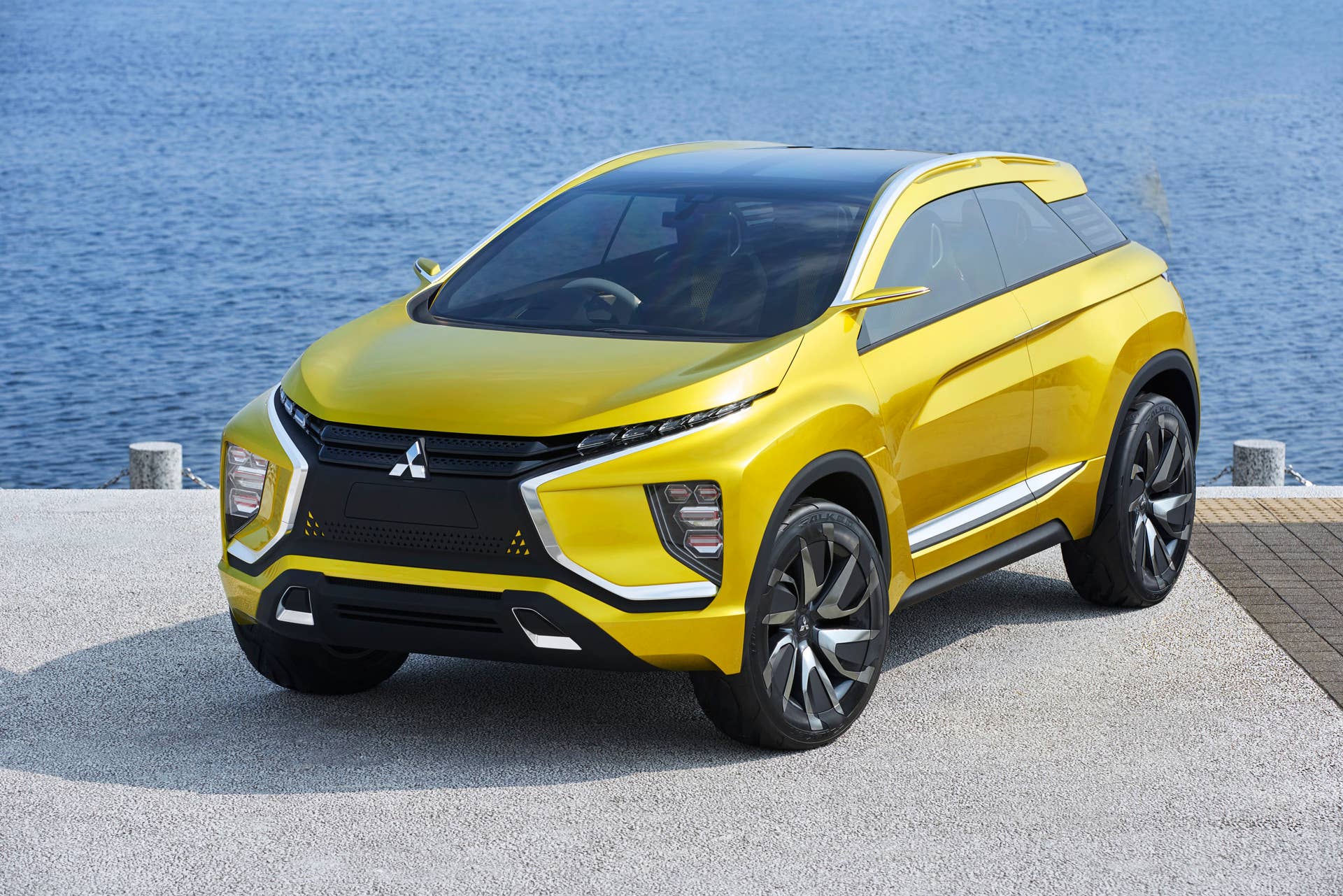 yellow mitsubishi ex concept front three quarters water