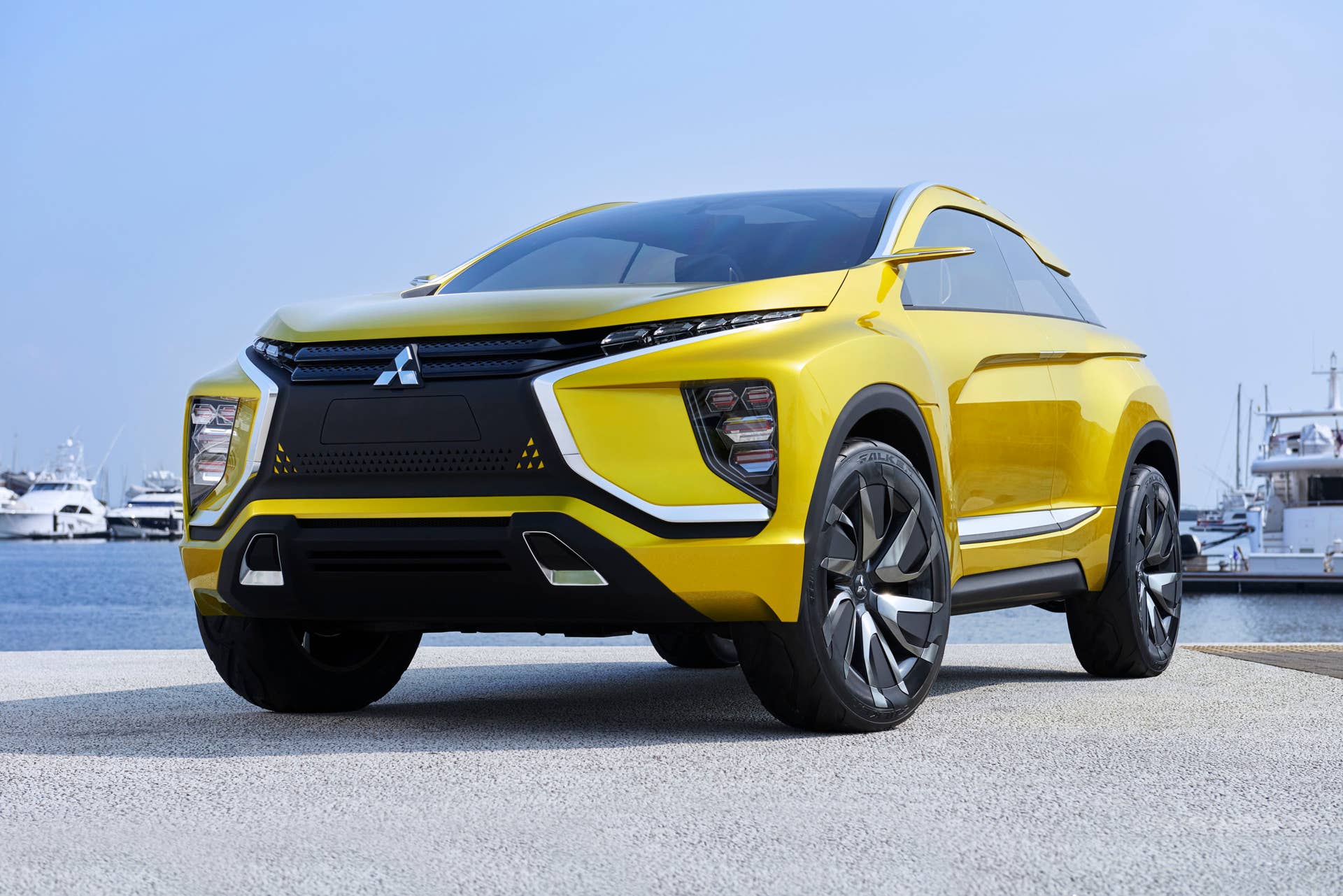 yellow mitsubishi ex concept front three quarters low