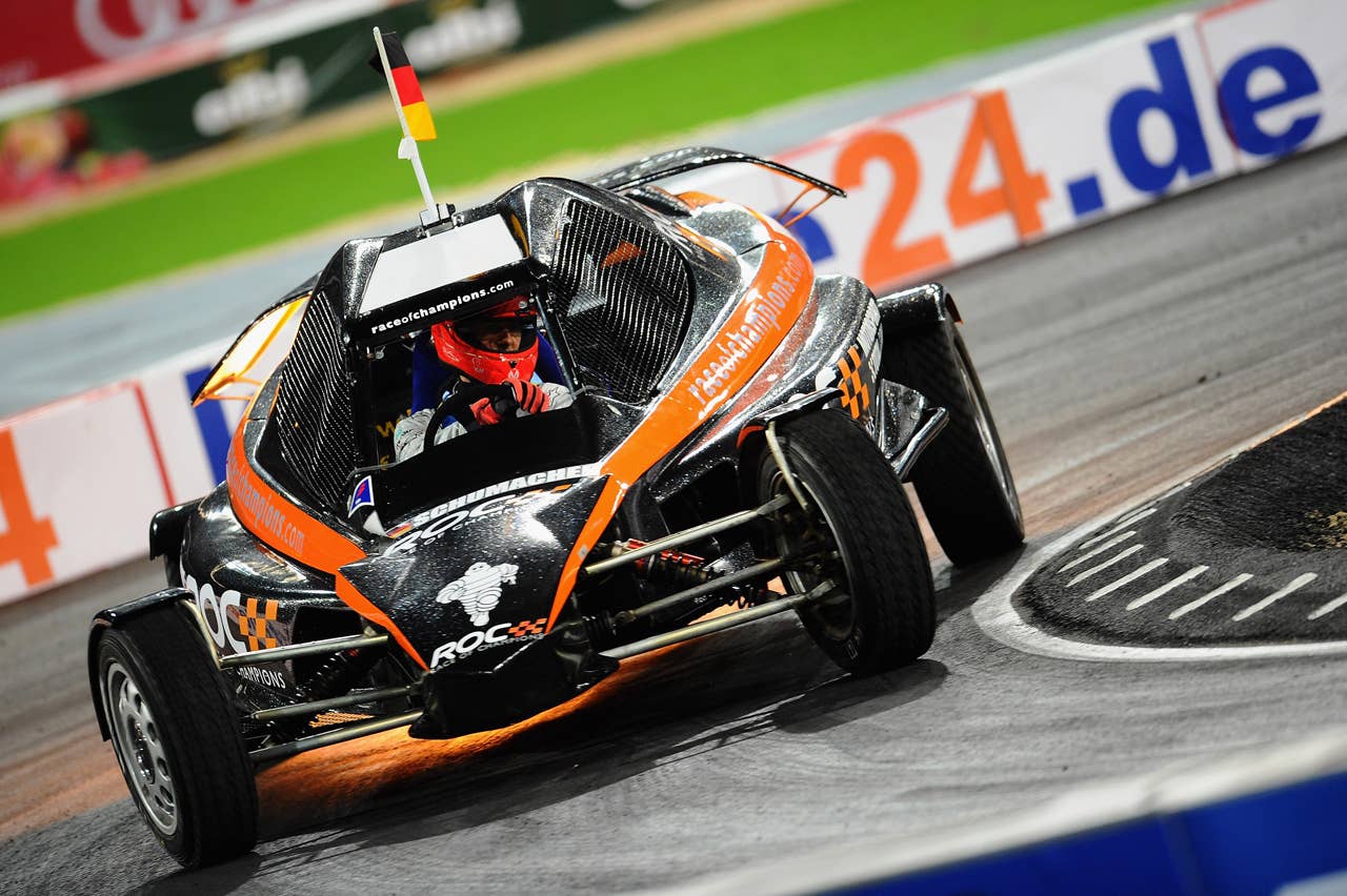 DUESSELDORF, GERMANY - DECEMBER 04:  Michael Schumacher of Germany races during day two of the race of champions event at the Esprit Arena on December 4, 2011 in Duesseldorf, Germany.  (Photo by Dennis Grombkowski/Bongarts/Getty Images)