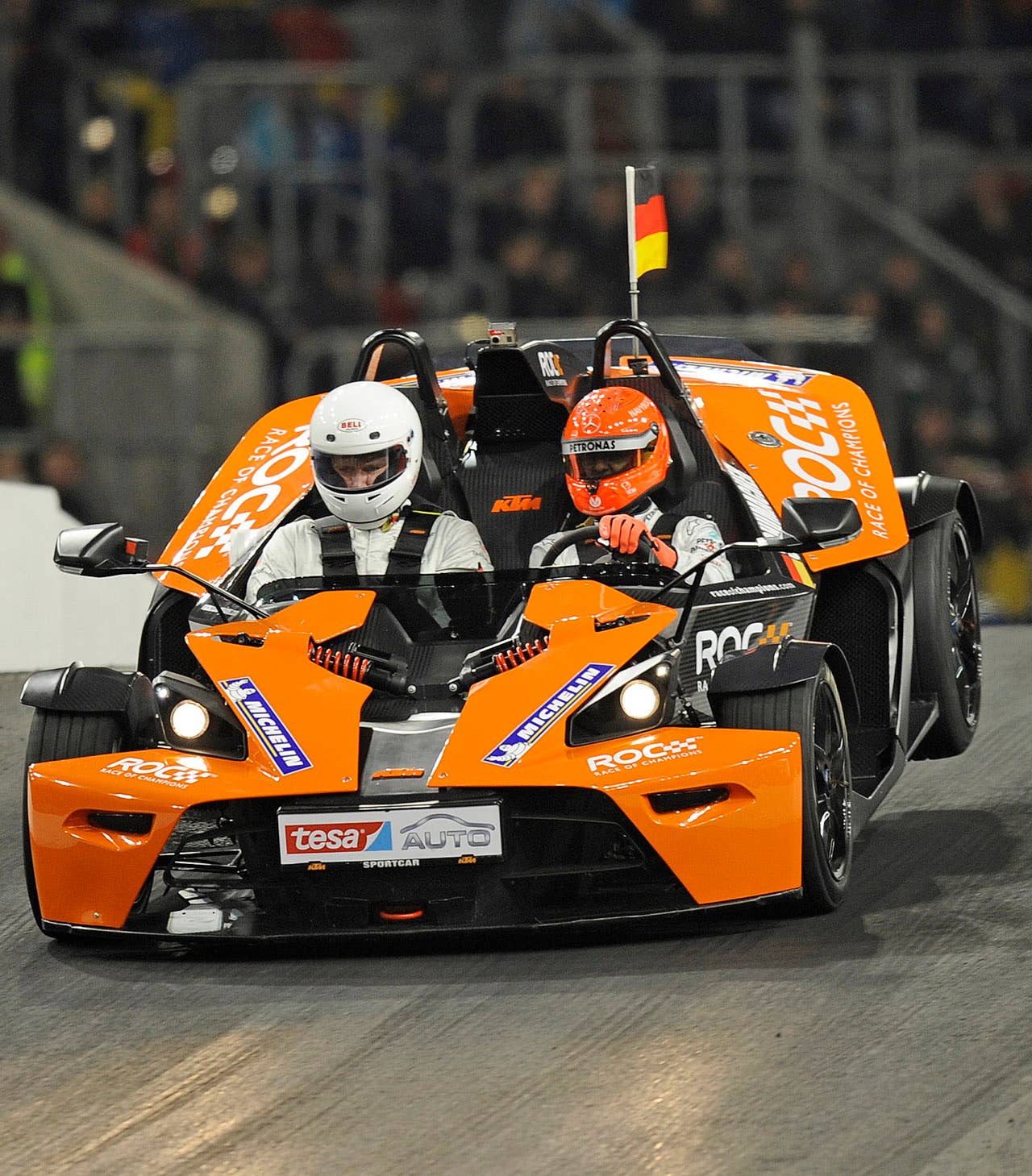 Germany's F1 legend Michael Schumacher, right, steers his car during the Race of Champions at the arena in Duesseldorf, western Germany, Saturday, Dec. 3, 2011.(AP Photo/Martin Meissner)