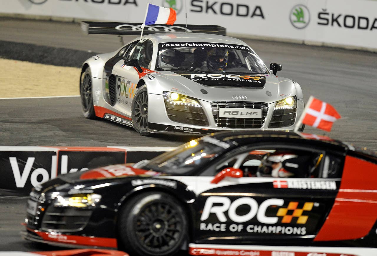 France's Sebastien Ogier, up, winning the final of the Race of Champions against second placed Tom Kristensen of Denmark, down,  at the arena in Duesseldorf, western Germany, Sunday, Dec. 4, 2011. (AP Photo/Martin Meissner)