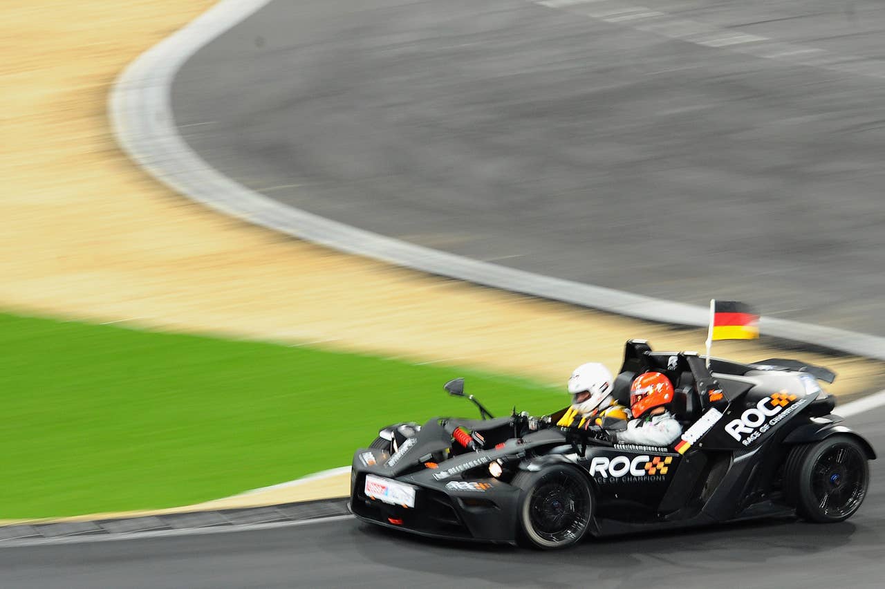 DUESSELDORF, GERMANY - DECEMBER 04:  Michael Schumacher of Germany races during day two of the race of champions event at the Esprit Arena on December 4, 2011 in Duesseldorf, Germany.  (Photo by Dennis Grombkowski/Bongarts/Getty Images)