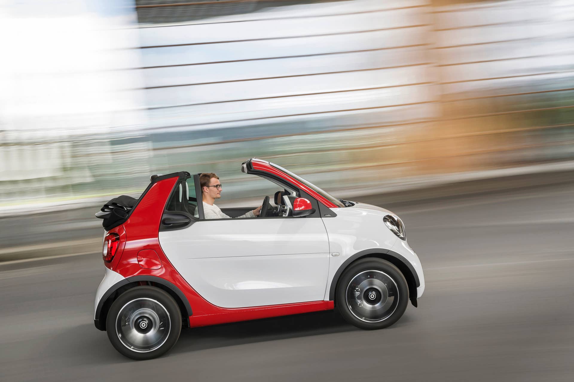 The 2016 Smart Fortwo Cabriolet, pure trim, side view, dynamic.