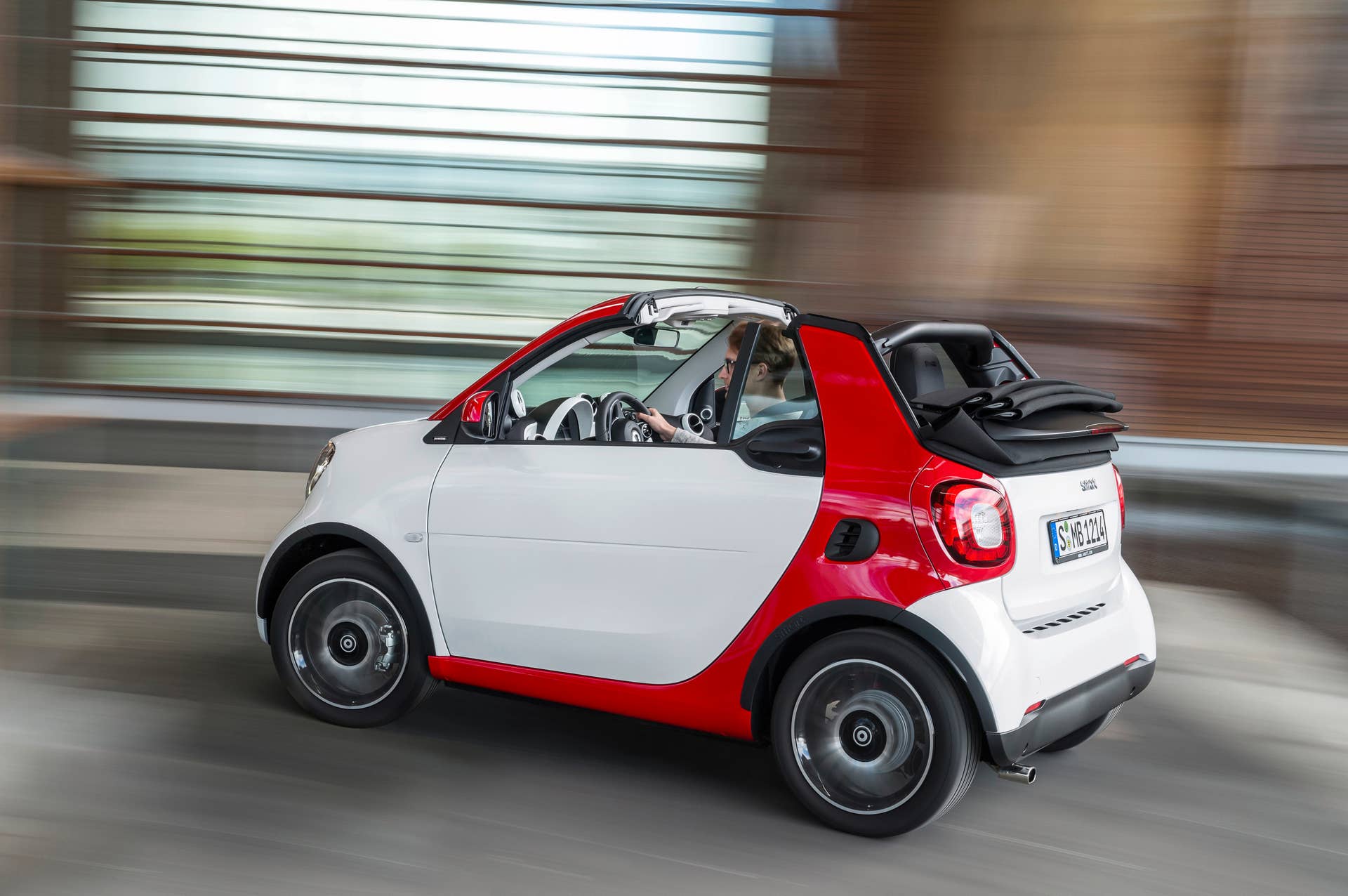 The 2016 Smart Fortwo Cabriolet, passion trim, rear three-quarter turning.