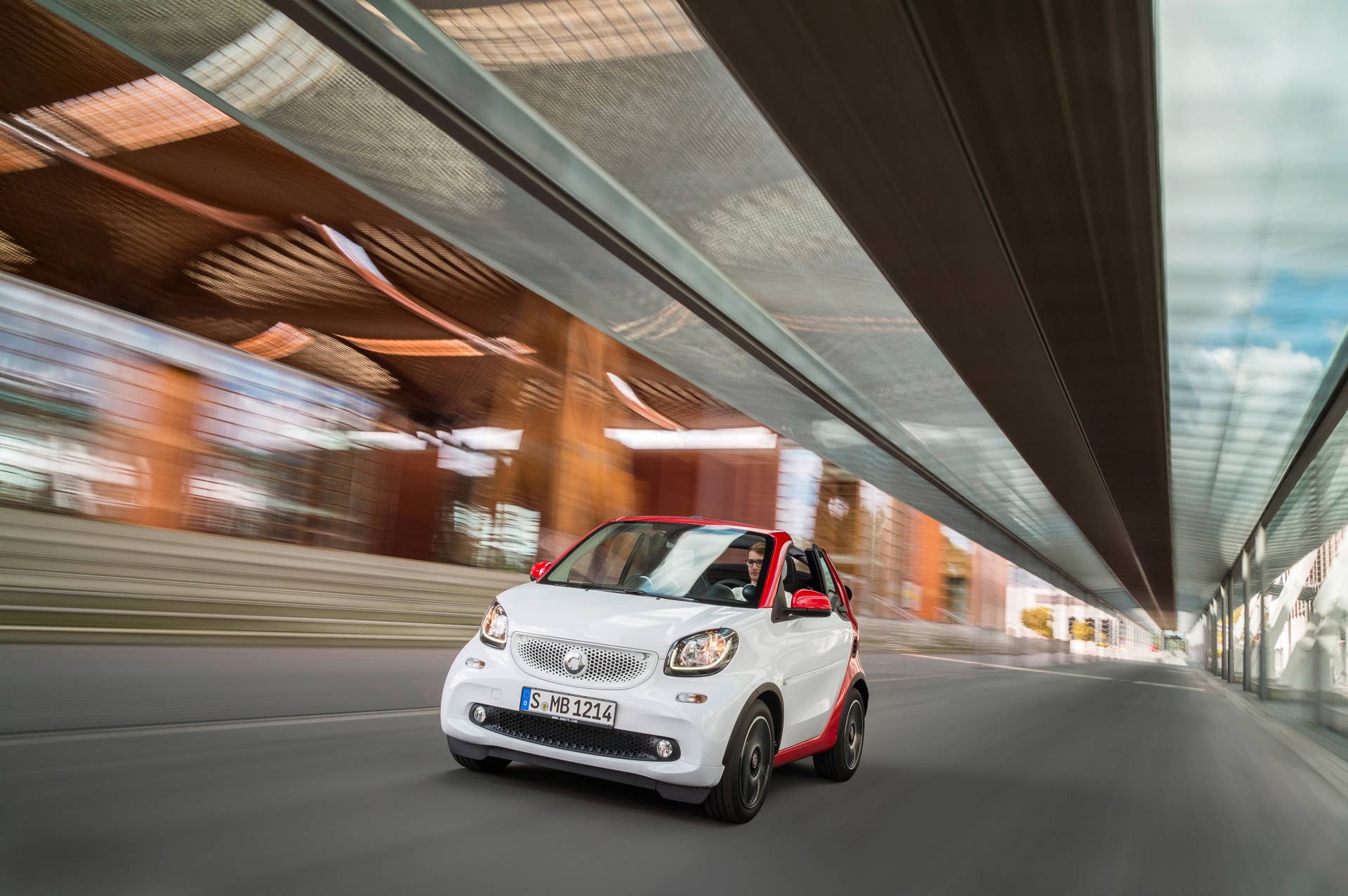 The 2016 Smart Fortwo Cabriolet, passion trim, front three-quarter under bridge.