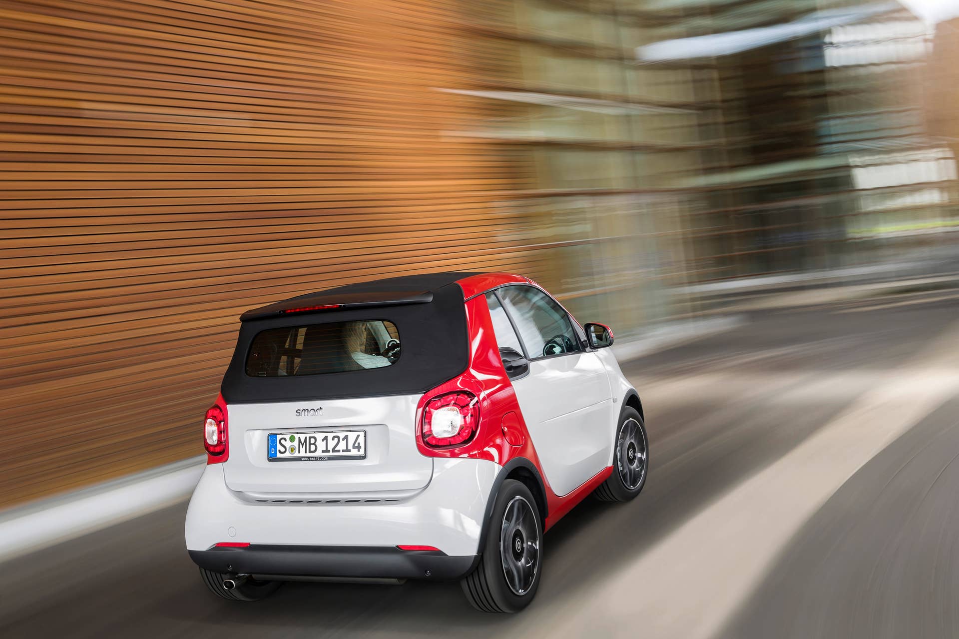 The 2016 Smart Fortwo Cabriolet, passion trim, rear three-quarter top up.