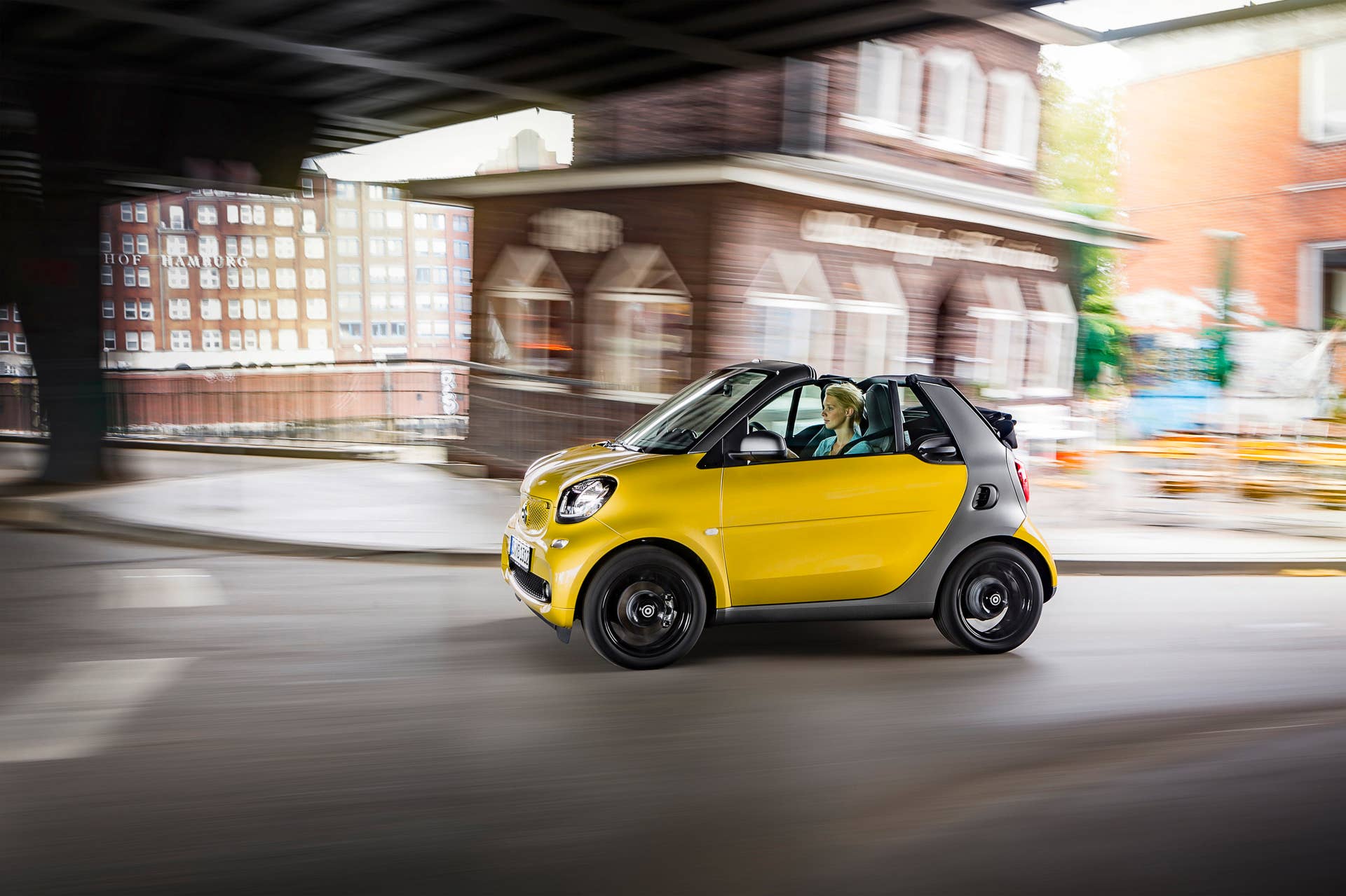 The 2016 Smart Fortwo Cabriolet, side view dynamic.