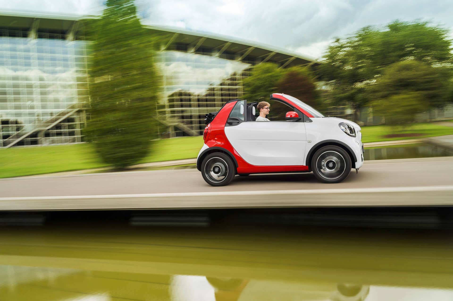The 2016 Smart Fortwo Cabriolet, pure trim, side view dynamic.