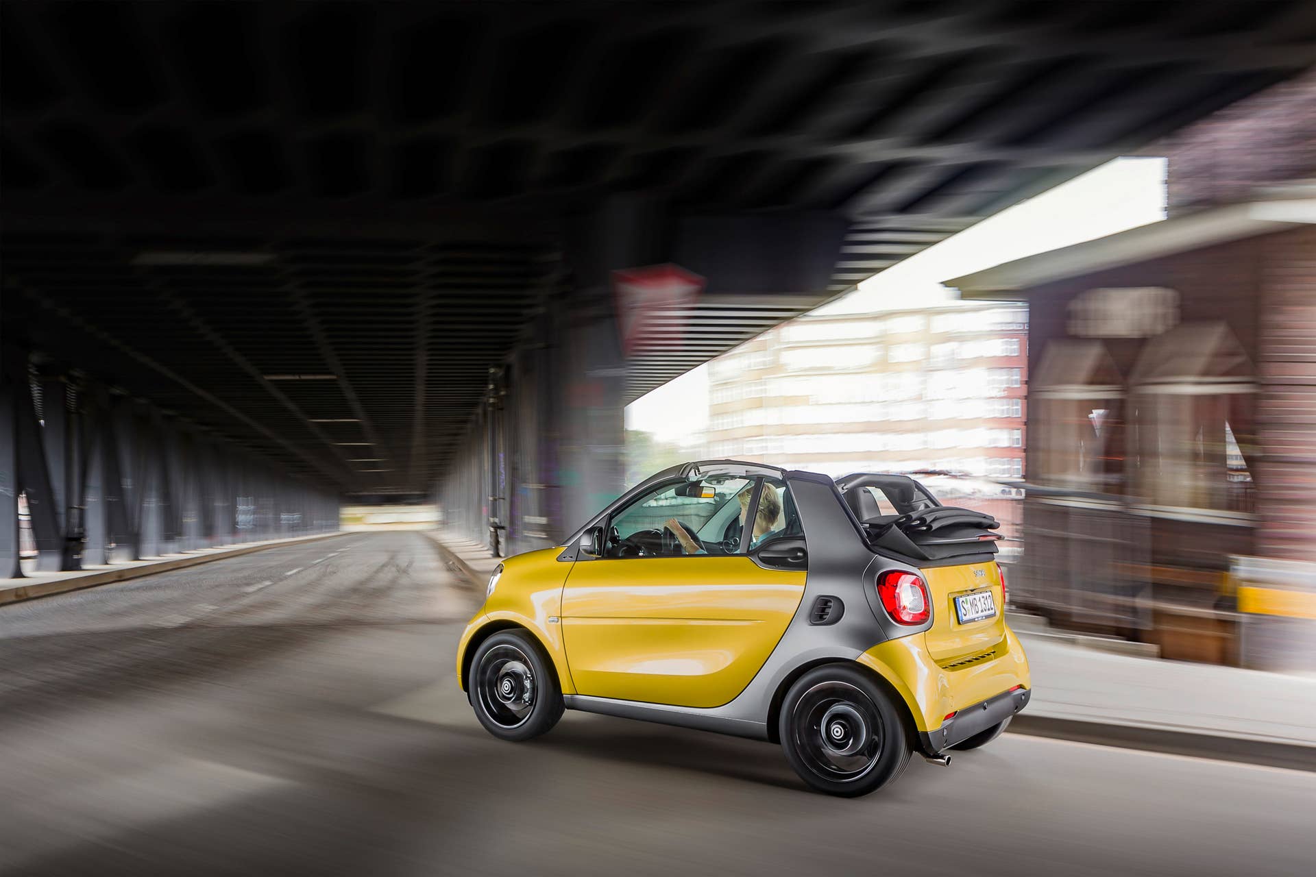 The 2016 Smart Fortwo Cabriolet, rear three-quarter dynamic.