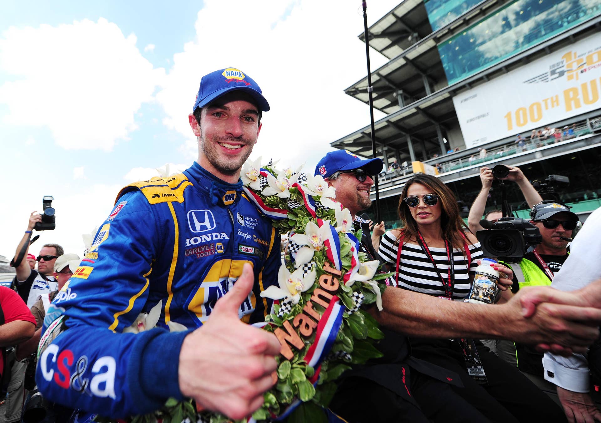 May 29, 2016; Indianapolis, IN, USA; Alexander Rossi gets ready to ride in a pace car after winning the 100th running of the Indianapolis 500 at Indianapolis Motor Speedway. Mandatory Credit: Thomas J. Russo-USA TODAY Sports