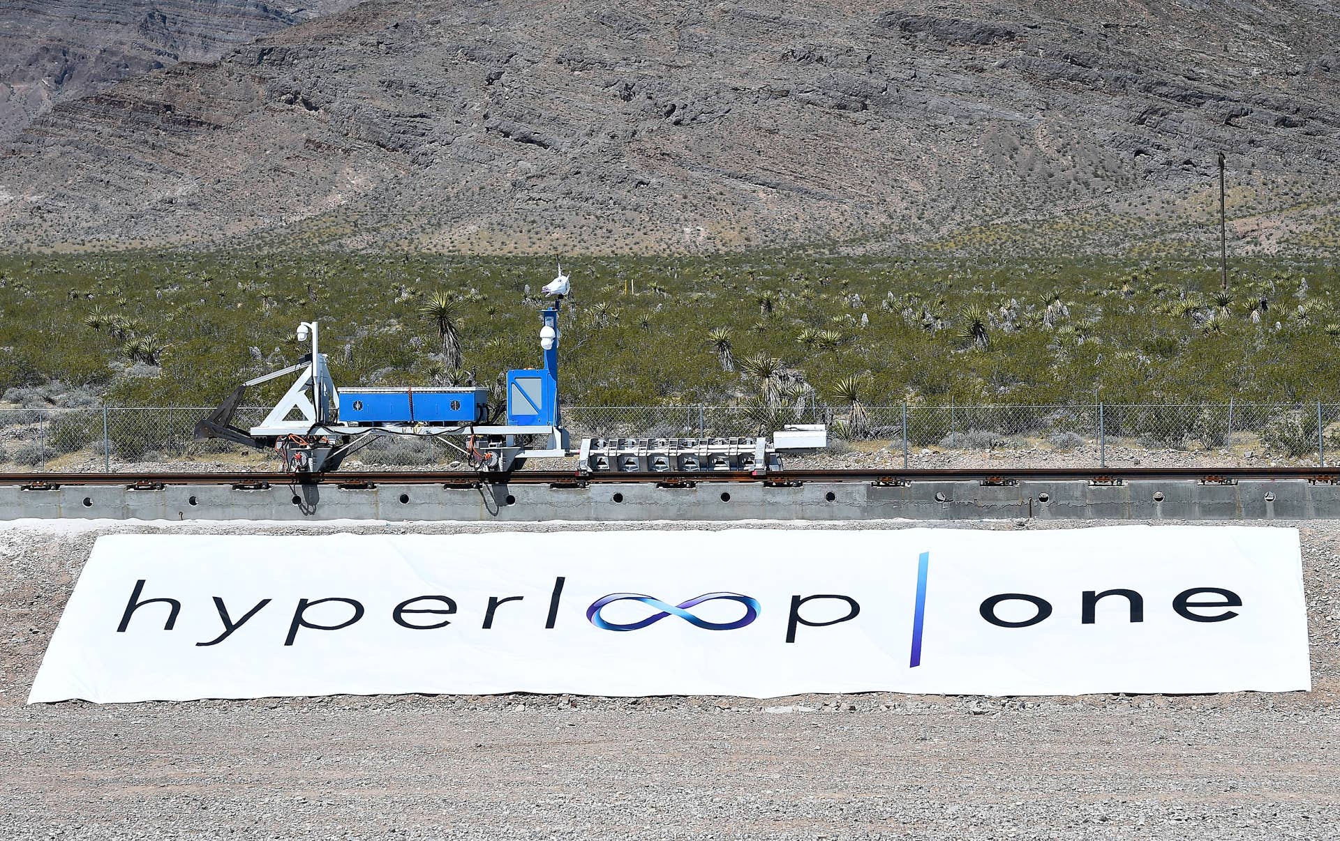 NORTH LAS VEGAS, NV - MAY 11: A recovery vehicle moves a test sled down a track after the first test of the propulsion system at the Hyperloop One Test and Safety site on May 11, 2016 in North Las Vegas, Nevada. The company plans to create a fully operational hyperloop system by 2020. (Photo by David Becker/Getty Images,)