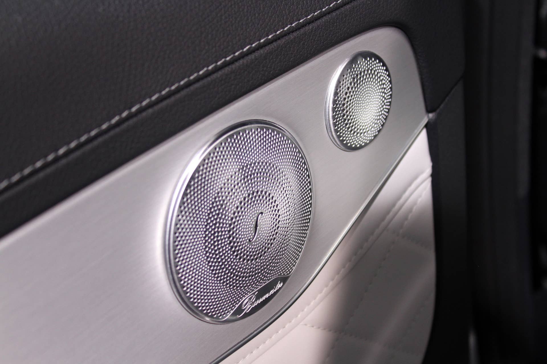 The 2016 Mercedes-Benz GLC 350e unveiled in Stuttgart, Burmester stereo speaker close-up.