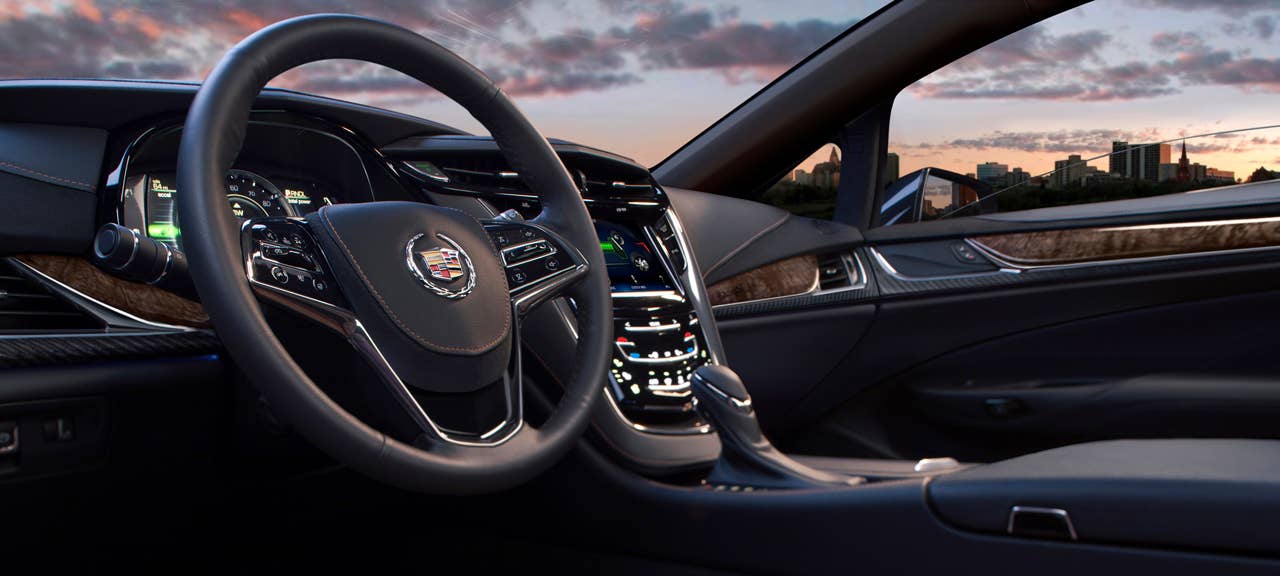 The 2014 Cadillac ELRs 2+2 layout is driver-focused and luxurious  distinctive for its craftsmanship and connectivity. The leather-trimmed interior blends authentic chrome and wood accents  and available carbon fiber trim  as well as a sumptuous microfiber headliner and steering wheel covered in leather and sueded microfiber. The ELR is the industrys only electric vehicle offered by a full-line luxury automaker. Production starts in late 2013.