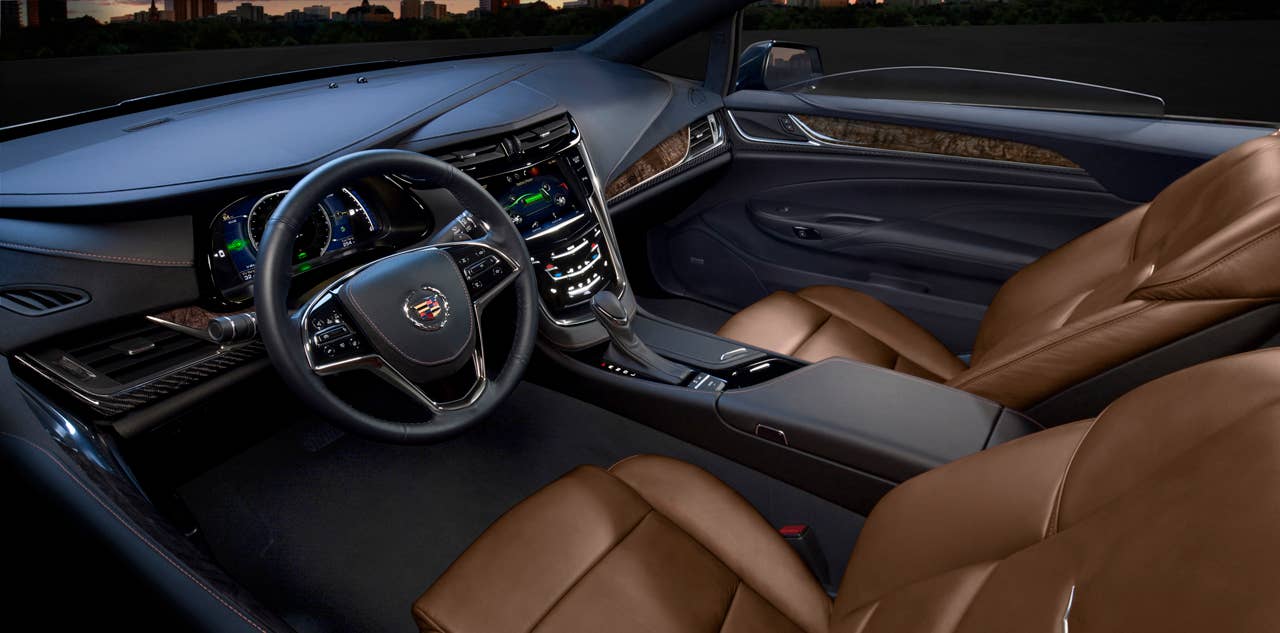 The 2014 Cadillac ELRs 2+2 layout is driver-focused and luxurious  distinctive for its craftsmanship and connectivity.  The leather-trimmed interior blends authentic chrome and wood accents  and available carbon fiber trim  as well as a sumptuous microfiber headliner and steering wheel covered in leather and sueded microfiber. The ELR is the industrys only electric vehicle offered by a full-line luxury automaker. Production starts in late 2013.