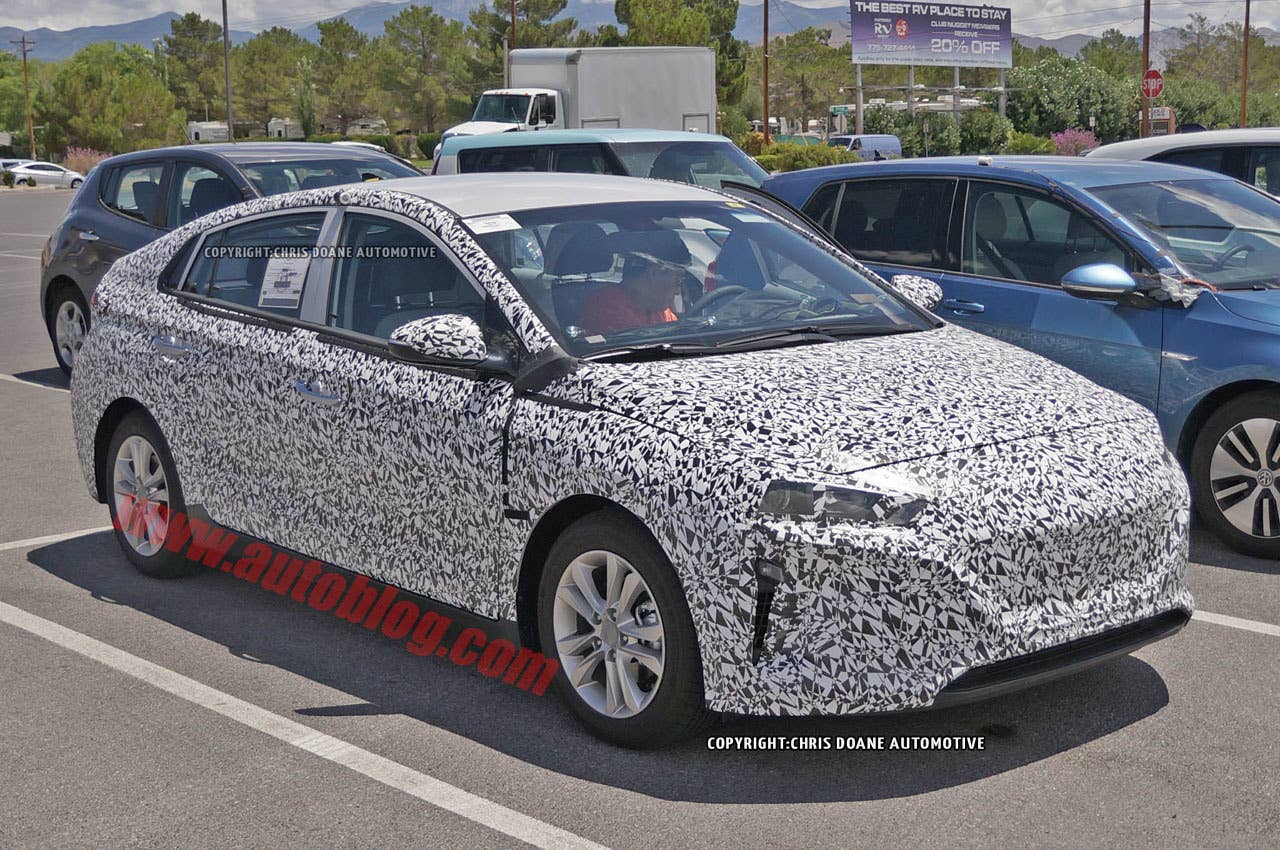 camouflaged hyundai prius-fighter spy shot front three quarters