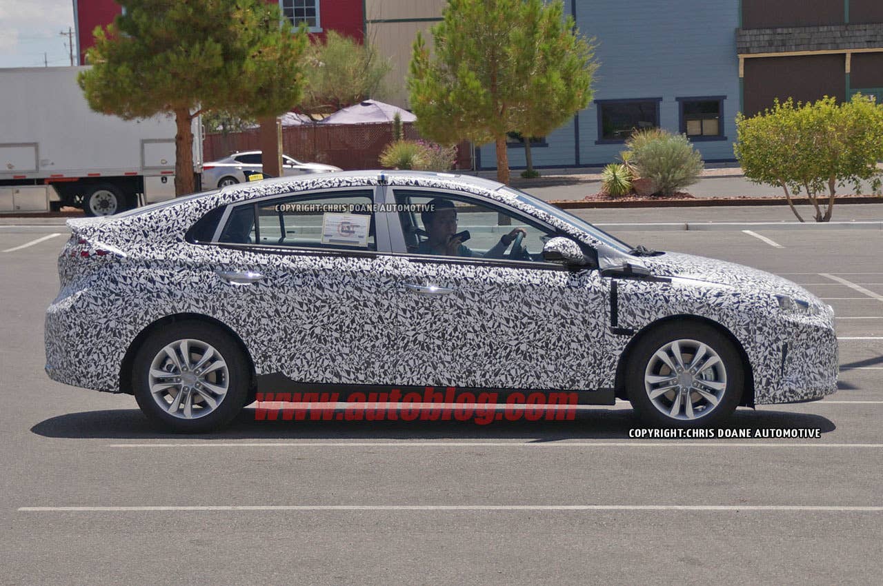 camouflaged hyundai prius-fighter spy shot profile