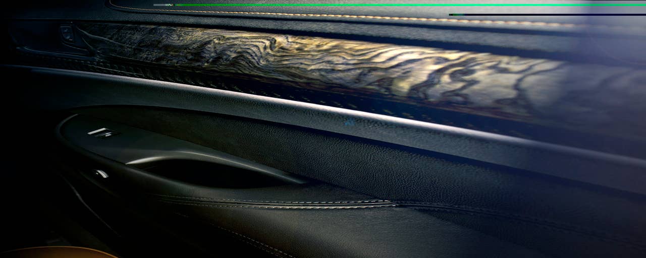 The 2014 Cadillac ELRs leather-trimmed interior blends authentic chrome and wood accents  and available carbon fiber trim  as well as a sumptuous microfiber headliner and steering wheel covered in leather and sueded microfiber. The ELR is the industrys only electric vehicle offered by a full-line luxury automaker. Production starts in late 2013.