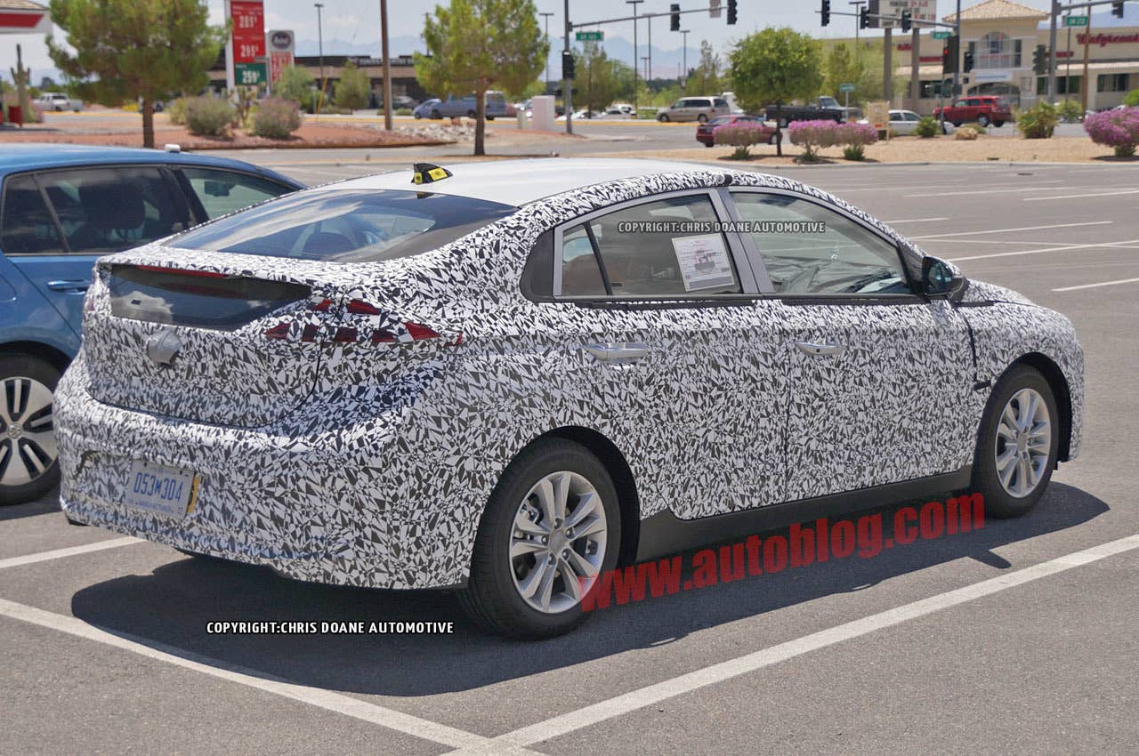 camouflaged hyundai prius-fighter spy shot rear three quarters
