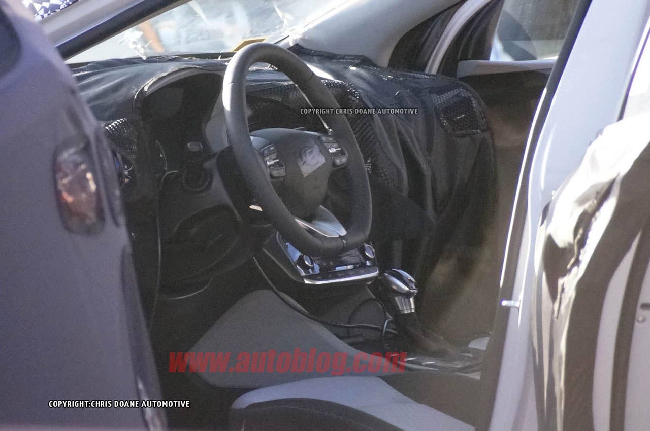 camouflaged hyundai prius-fighter spy shot interior